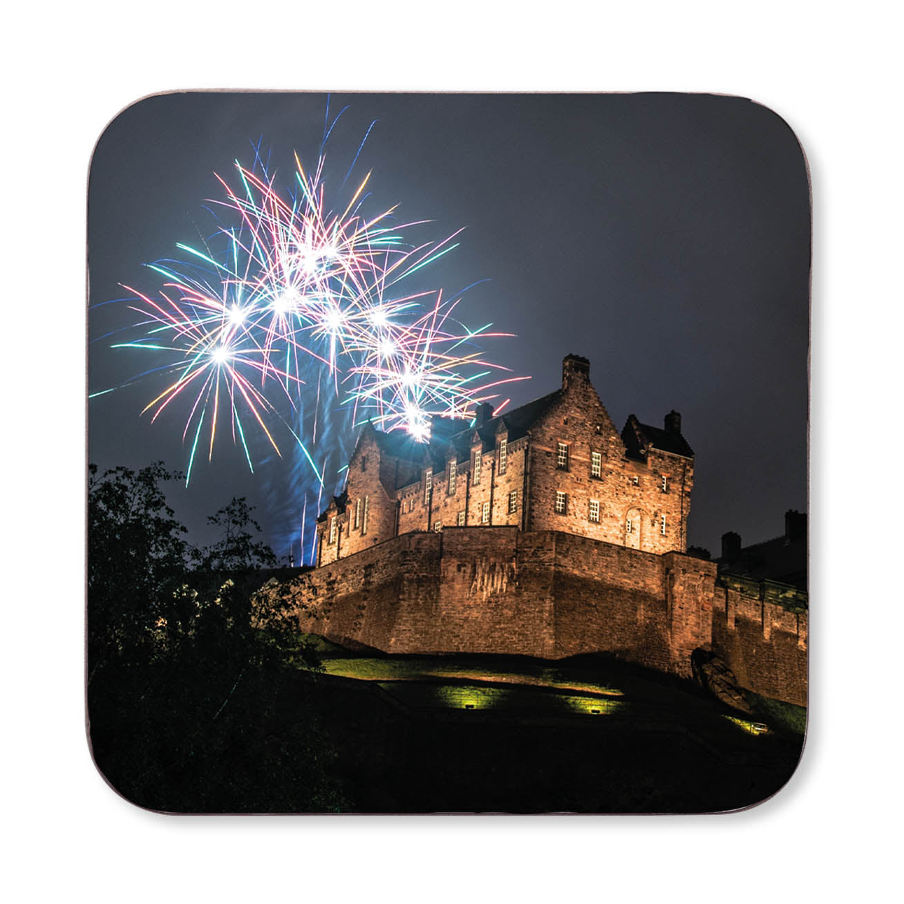 An image of fireworks exploding over a Edinburgh Castle at night on a coaster. 