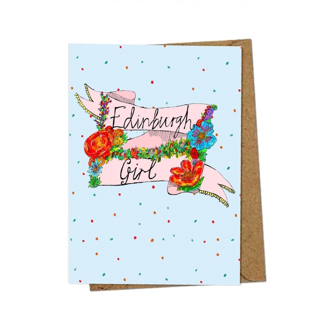 Edinburgh girl card featuring the text 'Edinburgh Girl' written inside a banner and surrounded by flowers on a blue spotty background.