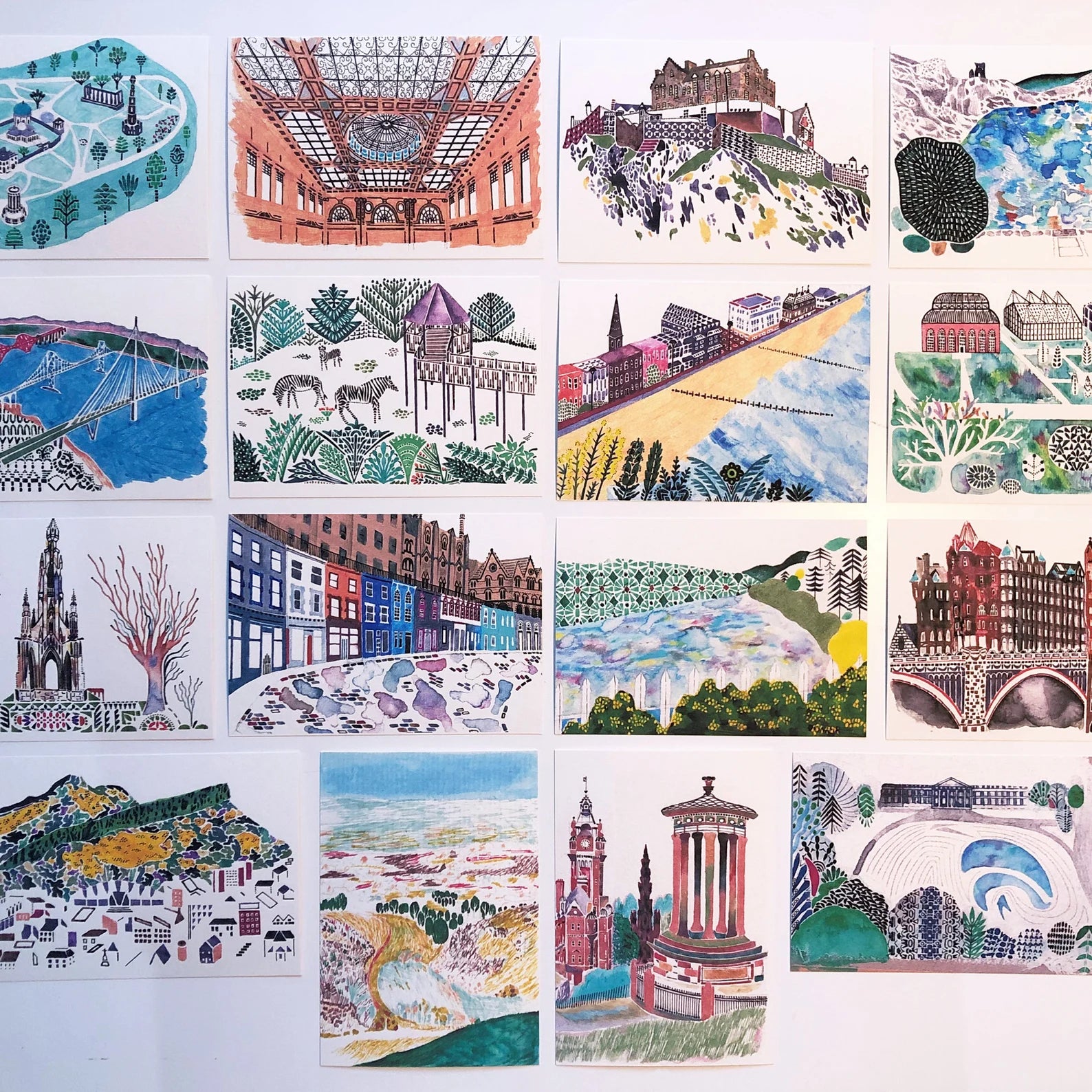 Collection of illustrated postcards featuring various scenes and landmarks.