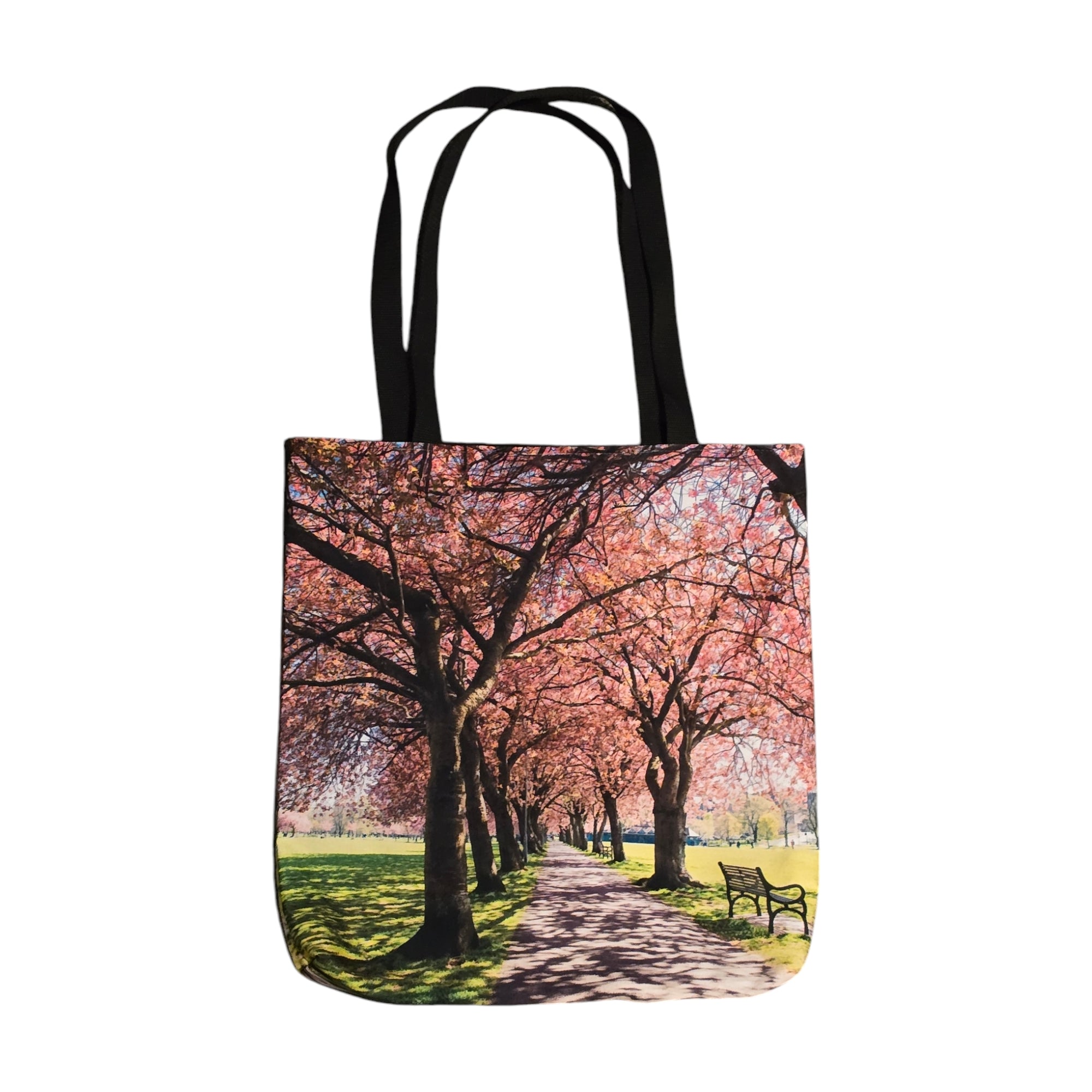 A picture of a tote bag featuring trees with blossom in the Meadows Edinburgh.