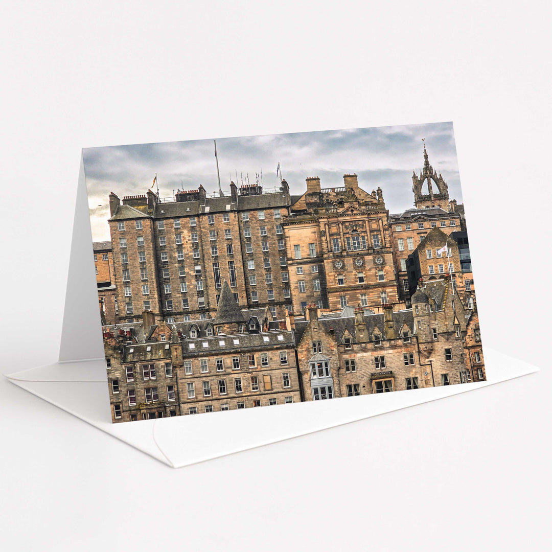 Greeting card with a scenic view of historic buildings on a white background