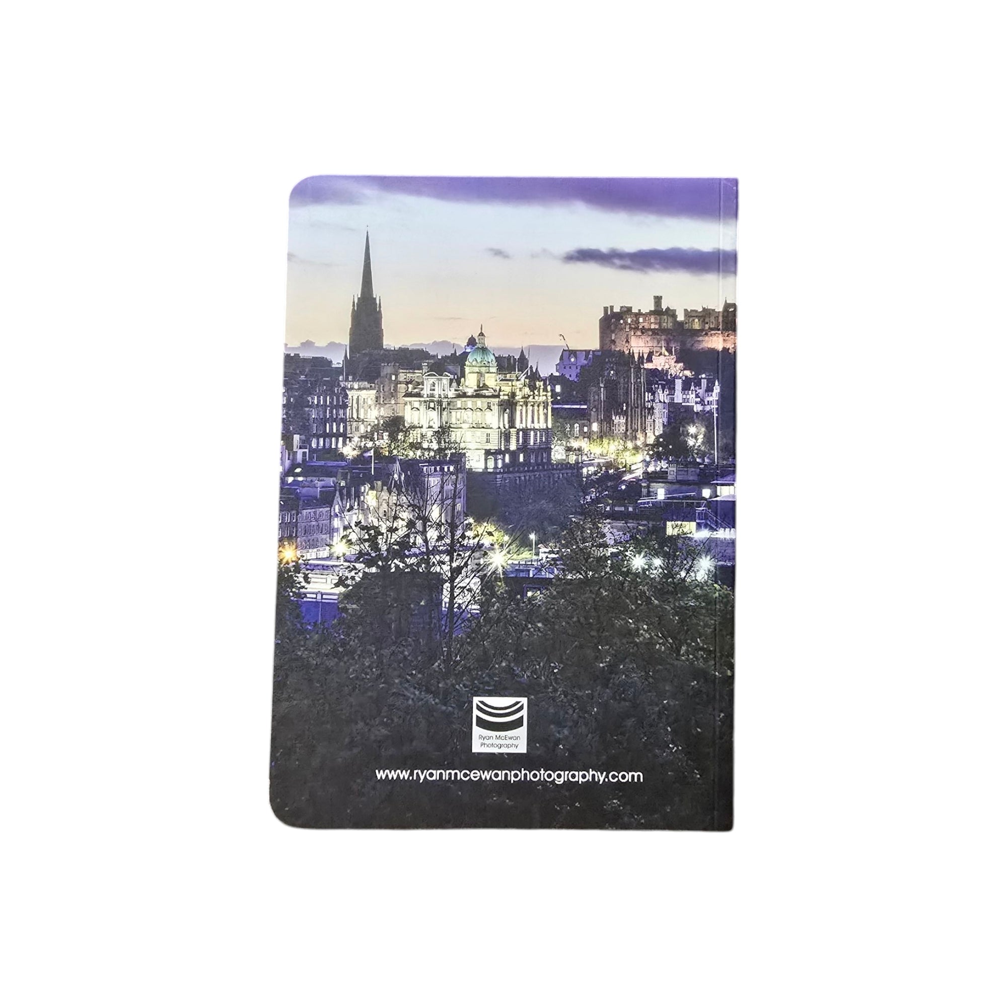 The back of a notebook showing an image of the Edinburgh skyline on it. 