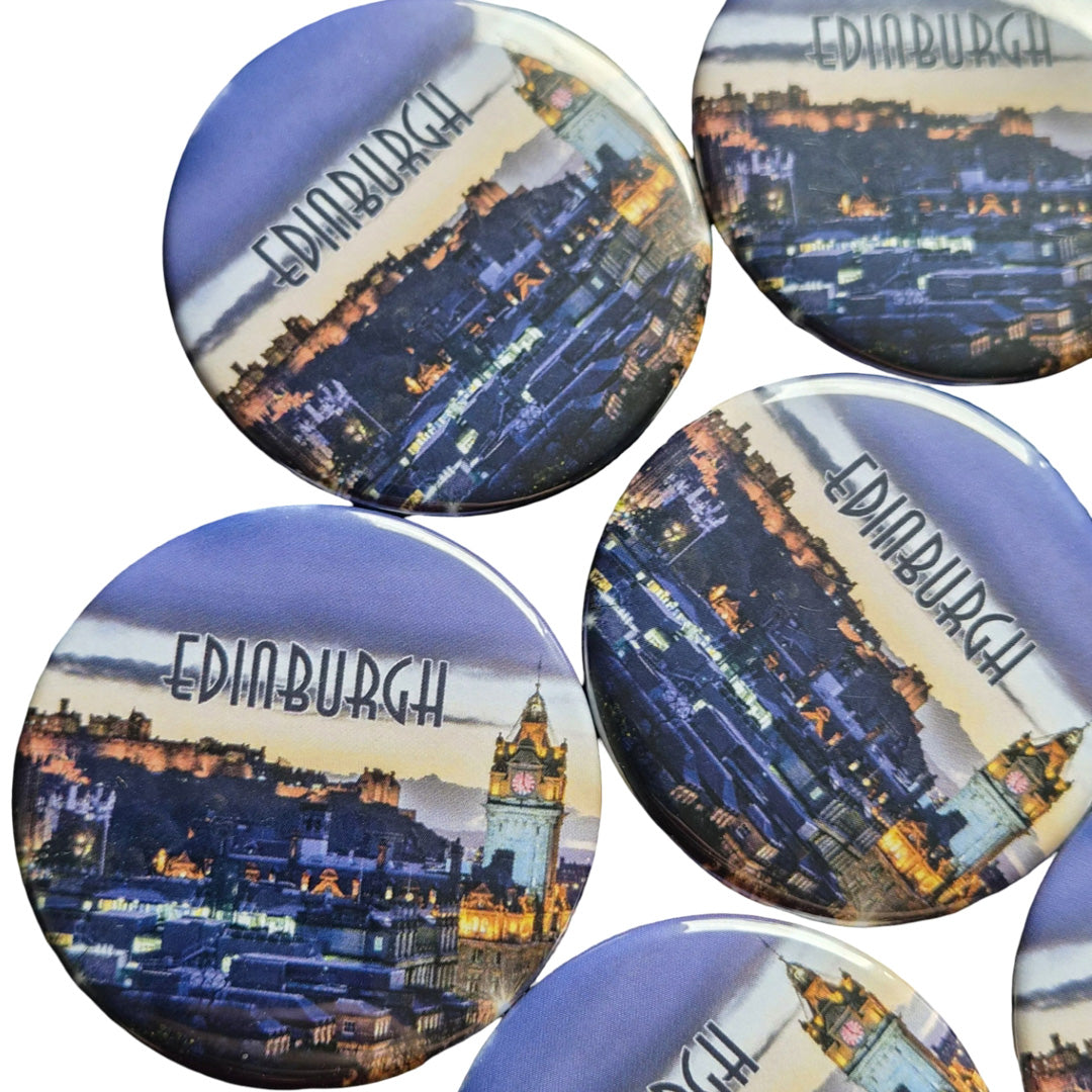 A group of round magnets with Edinburgh skyline printed on them against a white background. 
