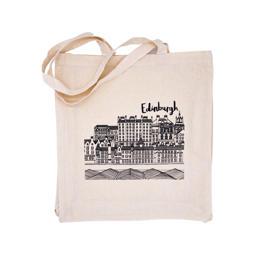 A beige cotton tote bag with an illustration of Edinburgh's skyline in black on the front.