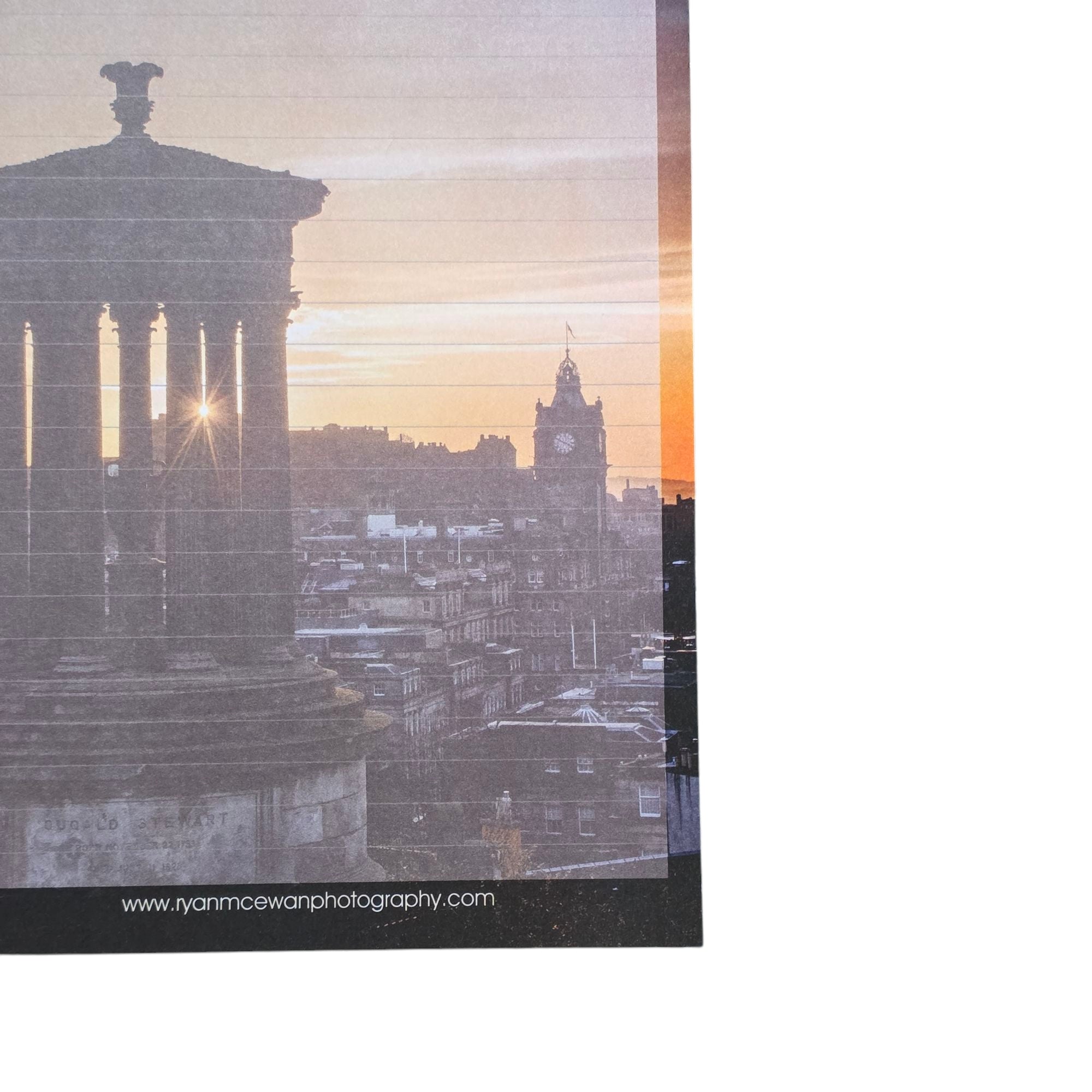 Close up of a notepad featuring and image of Edinburgh Castle from Calton Hill. 