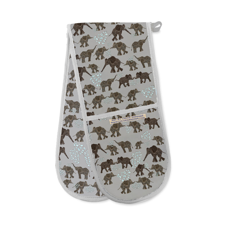 Grey oven gloves featuring dark grey elephants, some blowing water from their trunks.