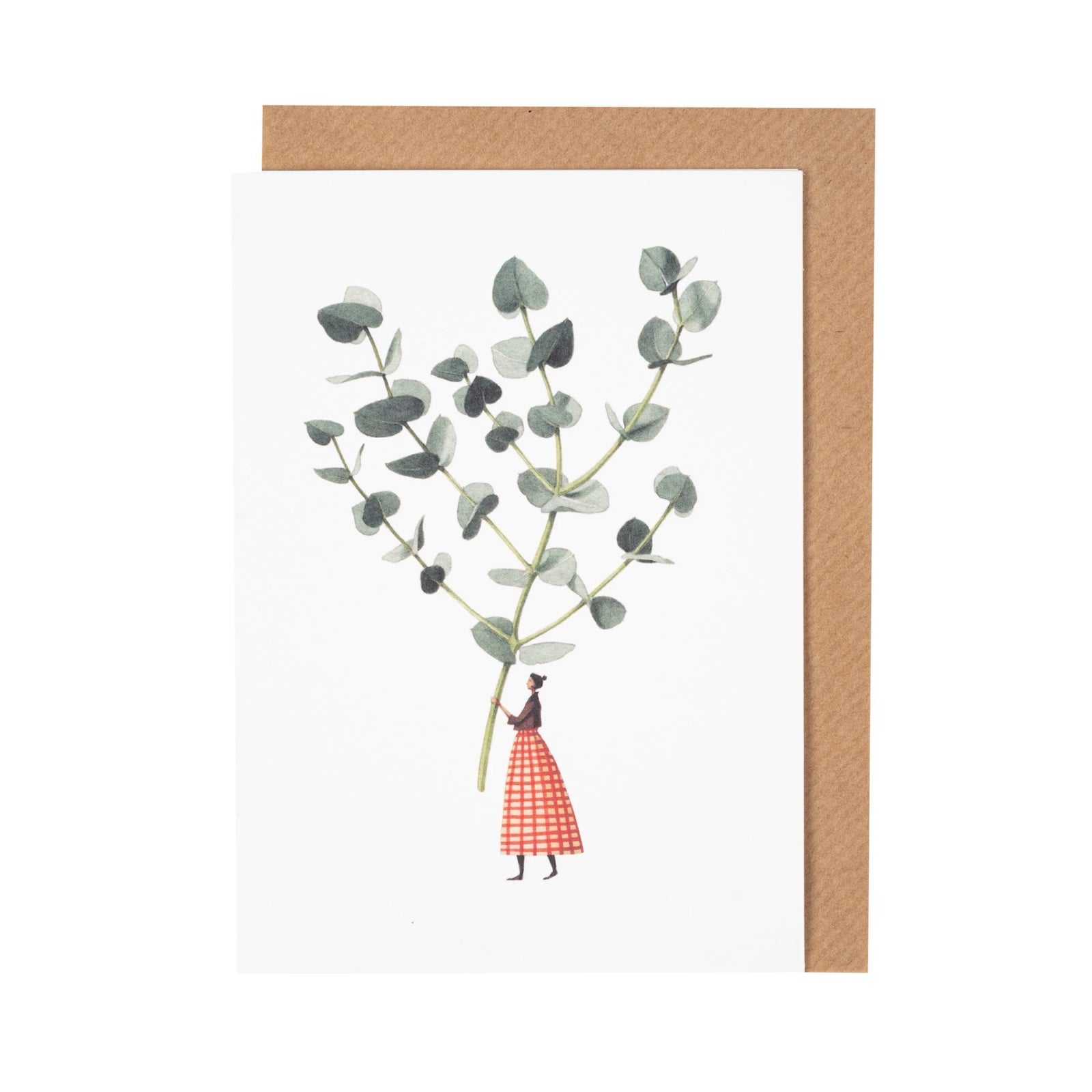 Christmas card featuring a fabulously dressed woman holding a eucalyptus branch.