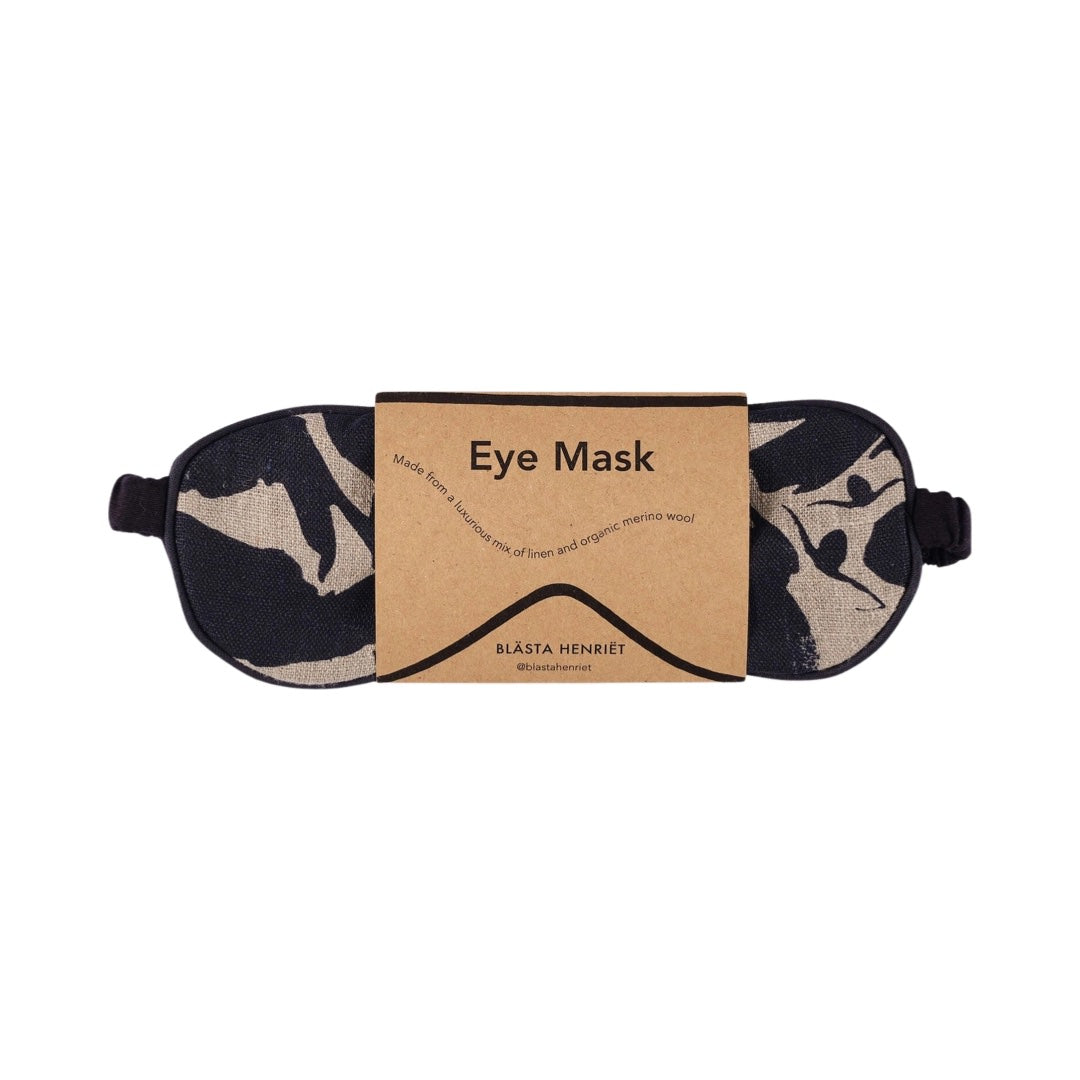 A navy and cream patterned linen eye mask.