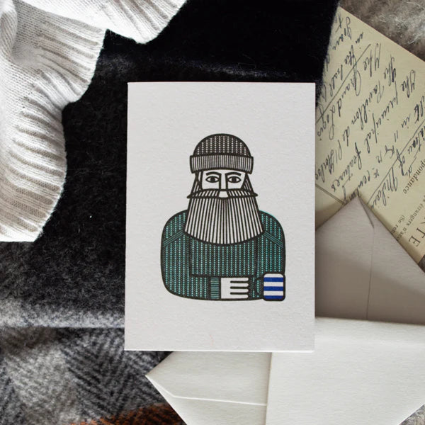 Illustration of a person wearing a knitted hat and scarf holding a mug on a pile of letters and envelopes.