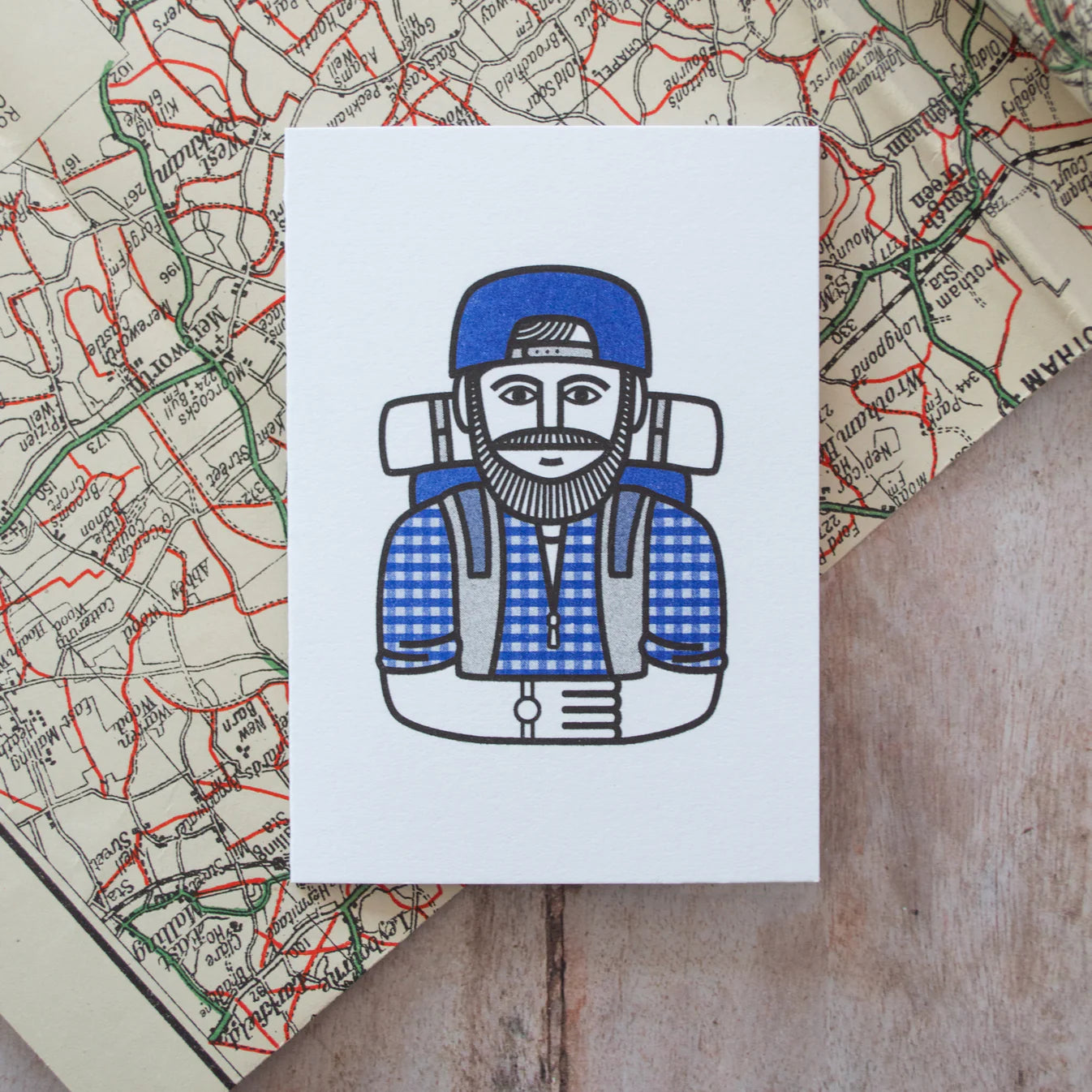 Illustration of a person with a backpack on a map.