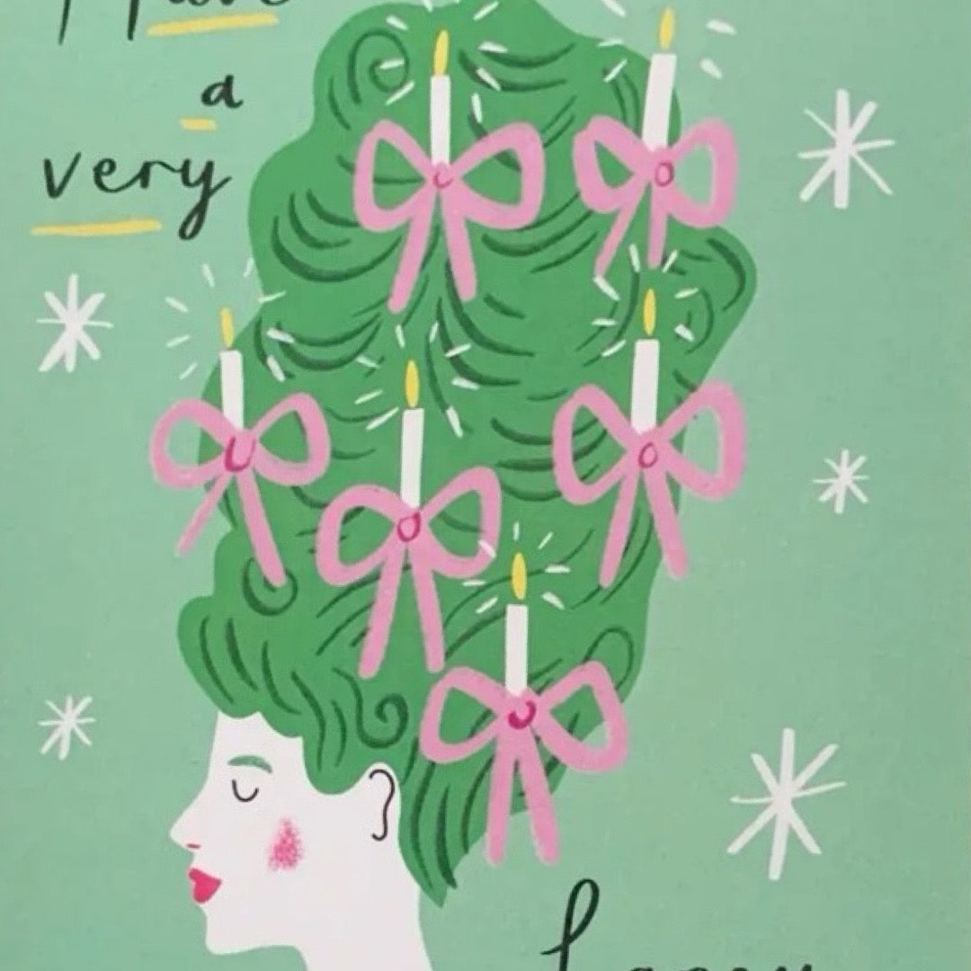Christmas card featuring a lady with a huge green beehive hairstyle with candles and pink bows in her hair and the text 'Have a Very Fancy Christmas'.