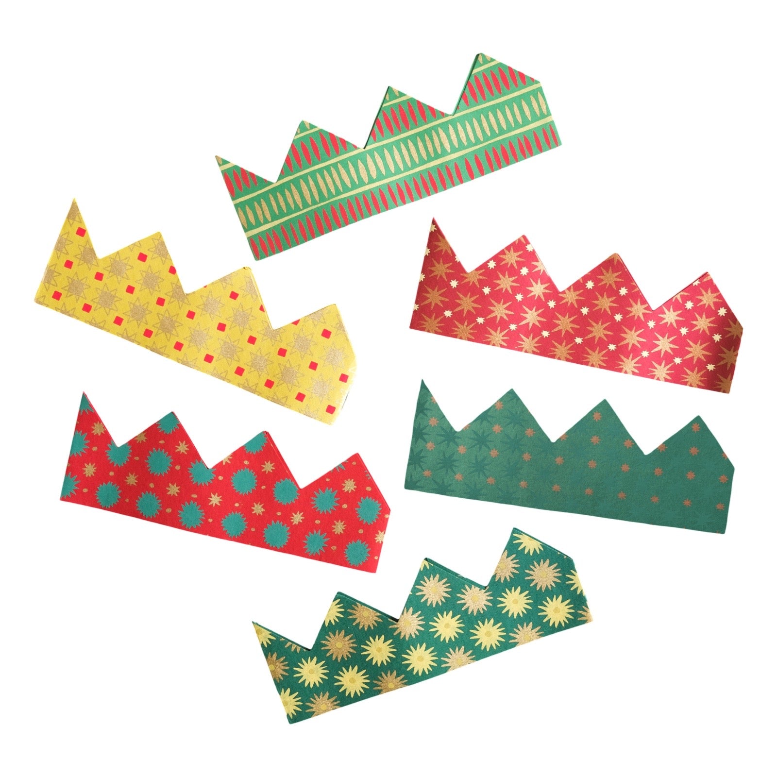 Six paper crown party hats in festive holiday colours, including gold, red, and green, arranged on a plain white background.