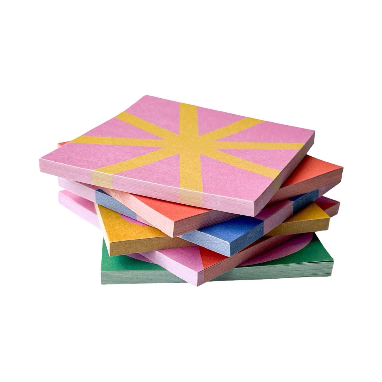 Stack of colorful sticky notes with geometric patterns on a white background.