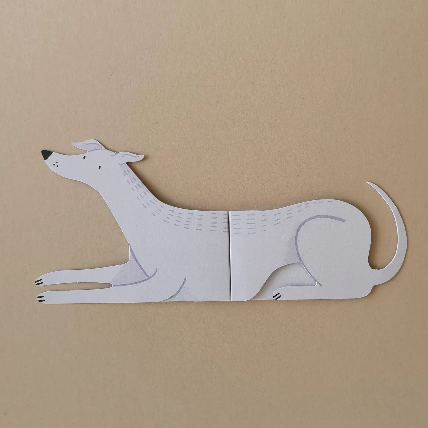 Grey dog card on a beige background.