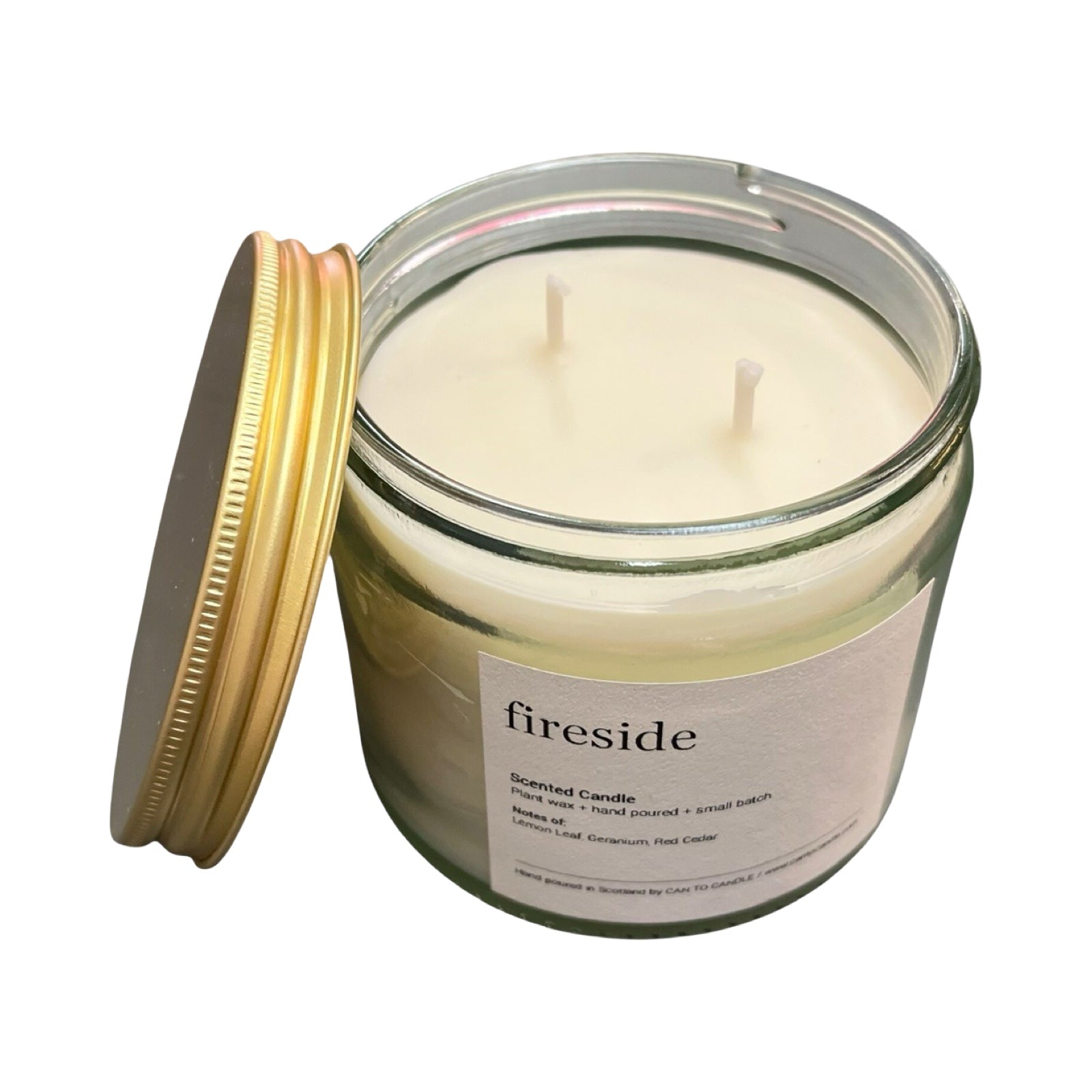Fireside scented candle in a glass jar with a gold lid on a white background.