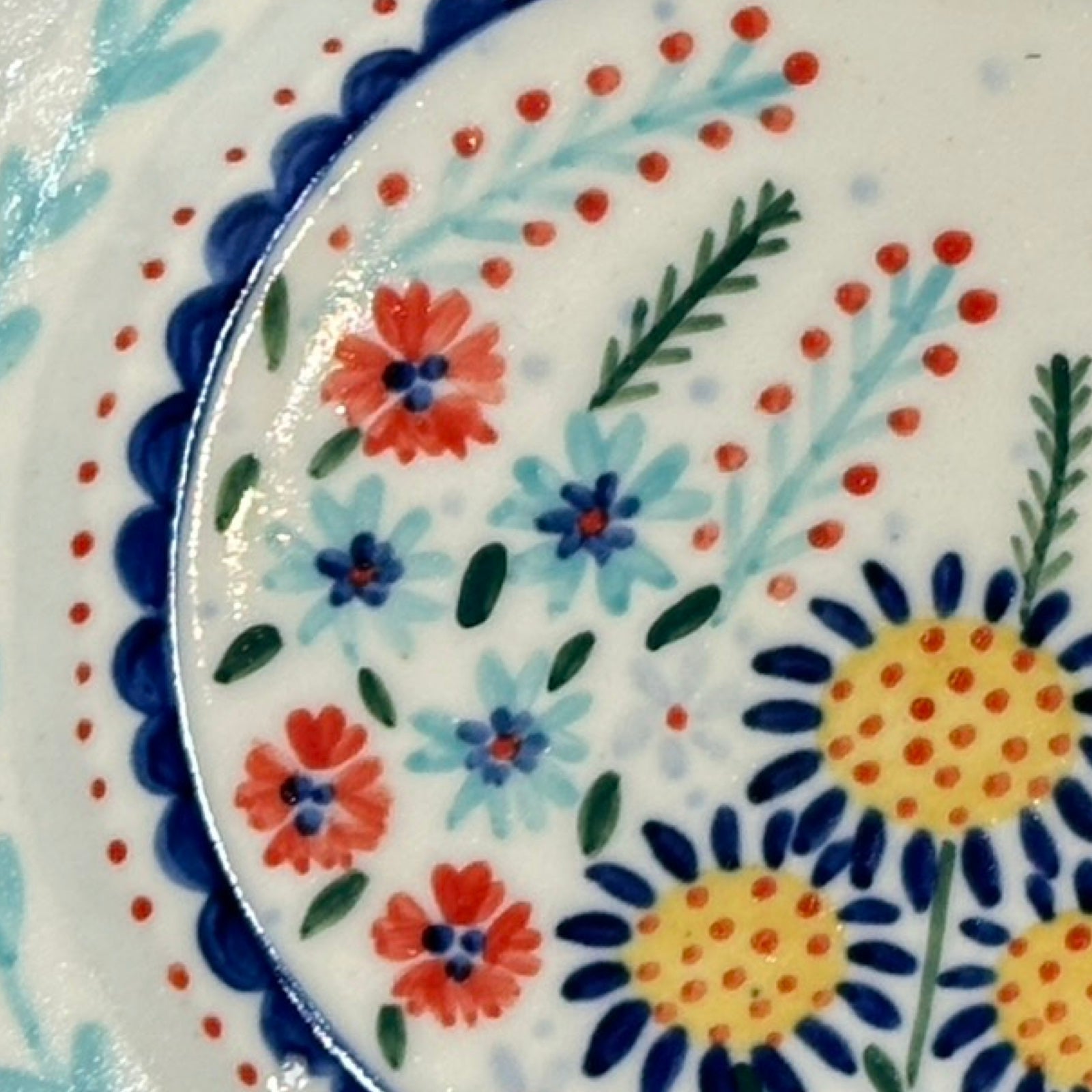 Decorative plate with colorful floral pattern.