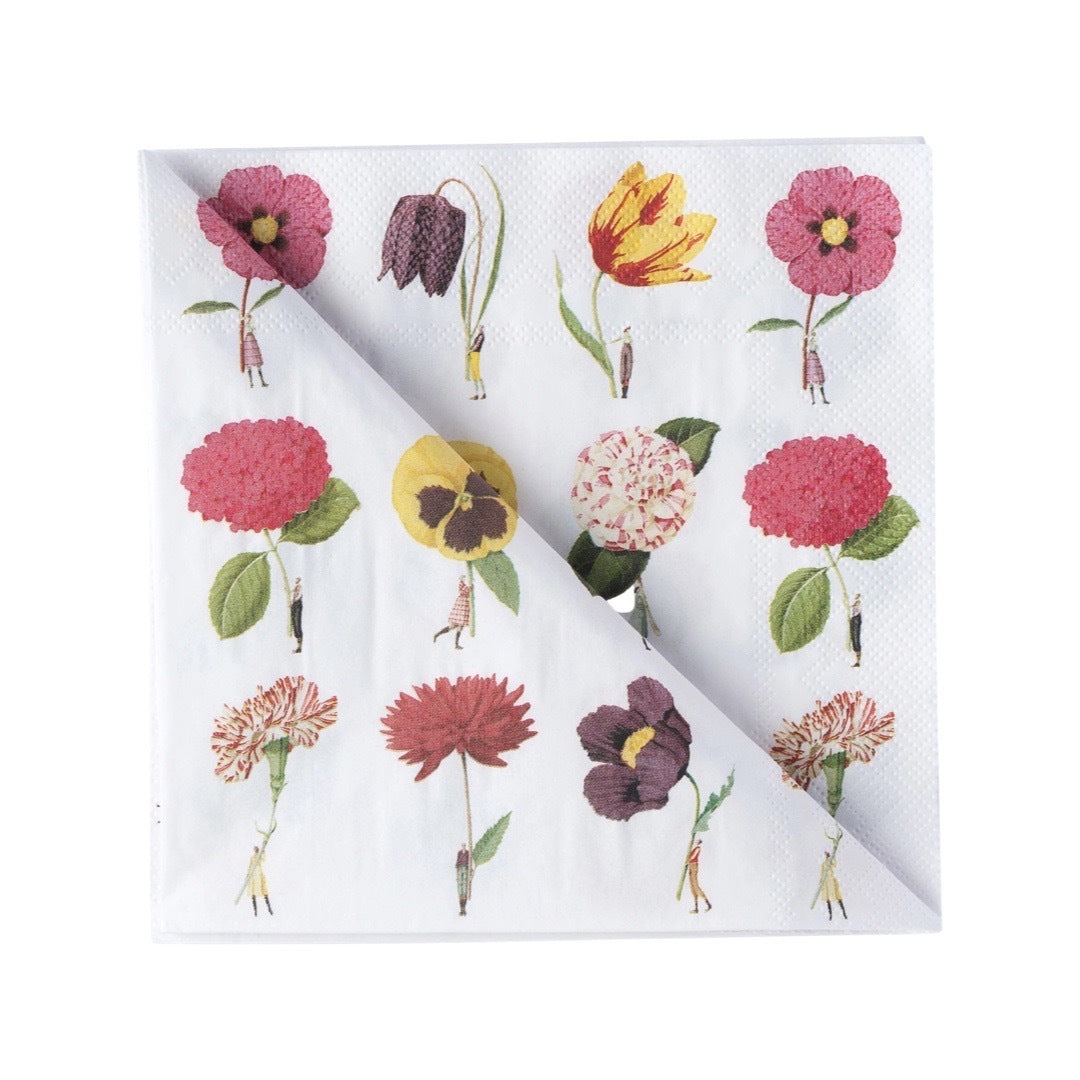 Folded paper napkin featuring twelve giant flowers being held by fabulously dressed men and women.