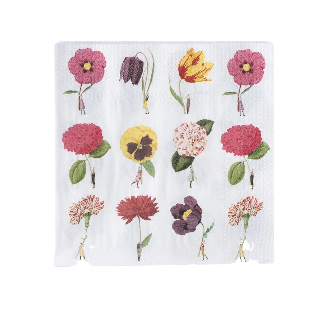Paper napkin featuring twelve giant flowers being held by fabulously dressed men and women.