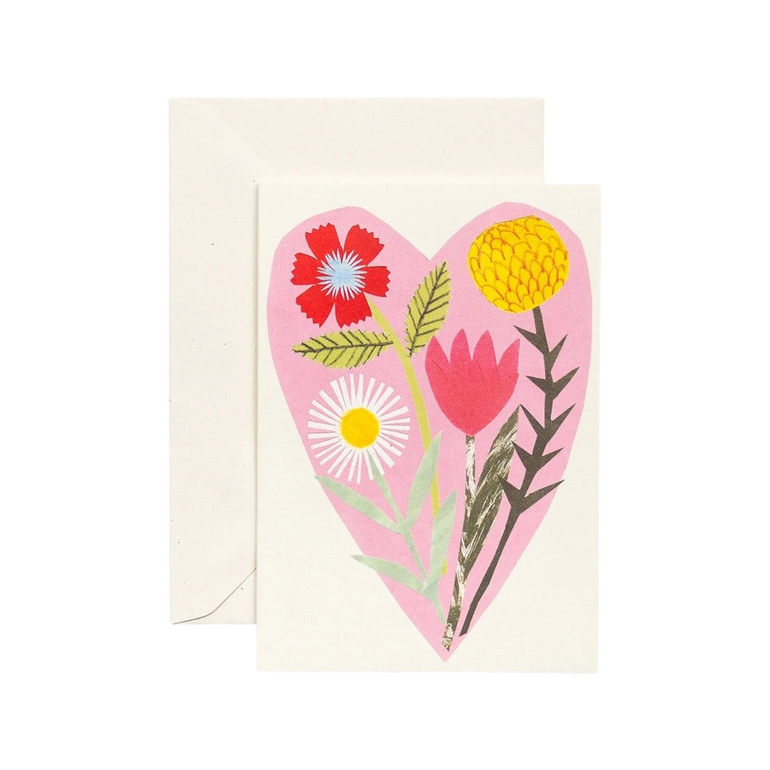 A card featuring a pink love heart with a colourful bouquet of flowers inside.