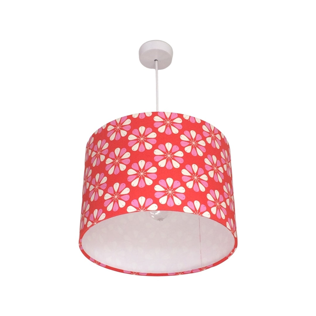 Drum lampshade featuring a red background with pink and white flowers.
