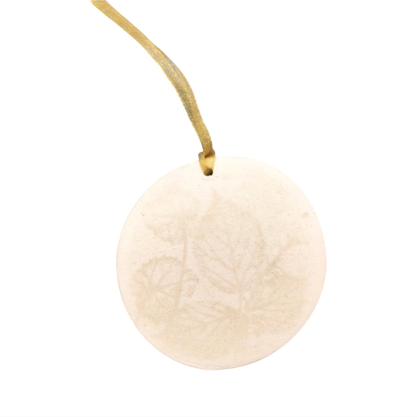 Round beige ornament with a string on a white background