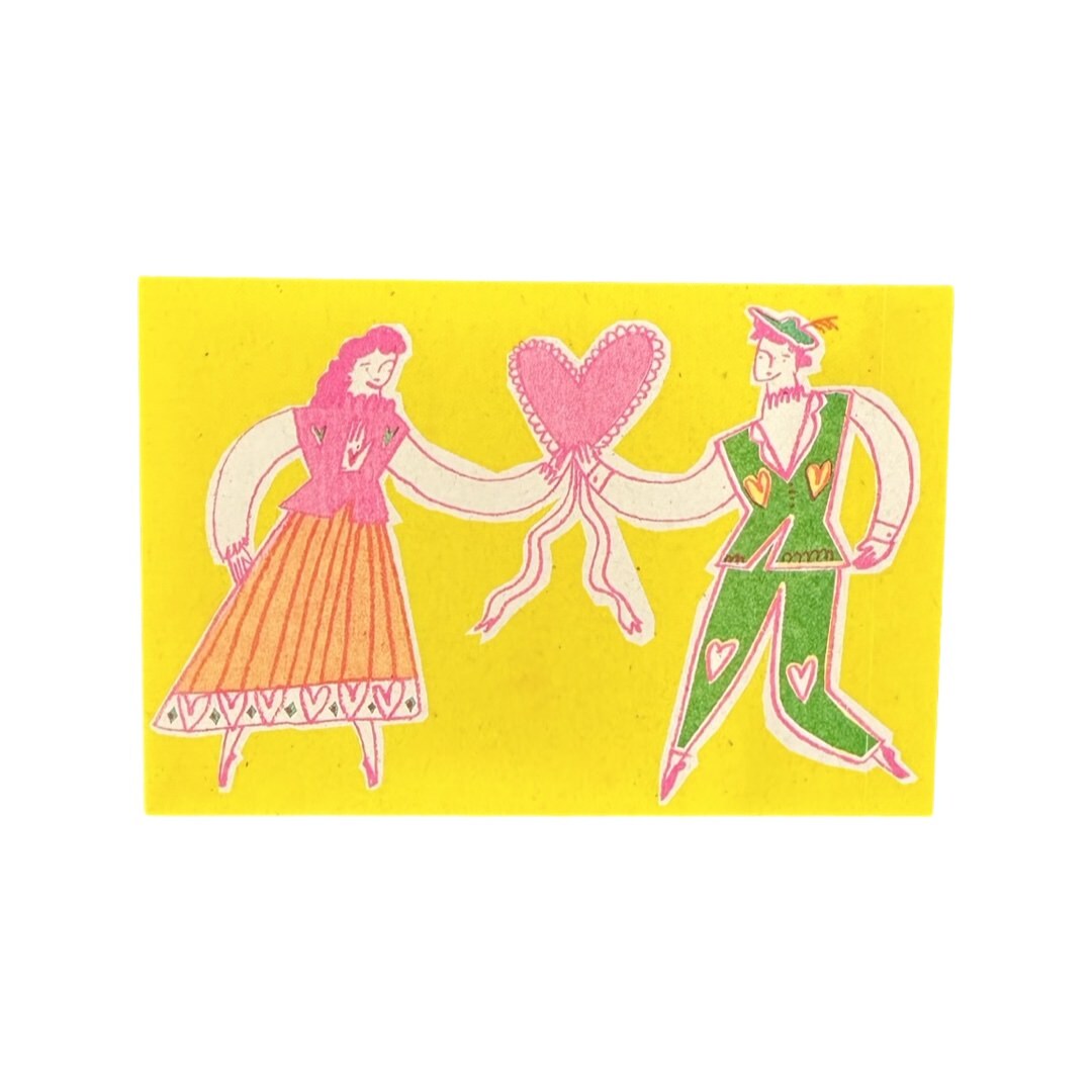 Mini print featuring an illustration of a couple, drawn in a folk style, holding hands with a pink heart balloon.