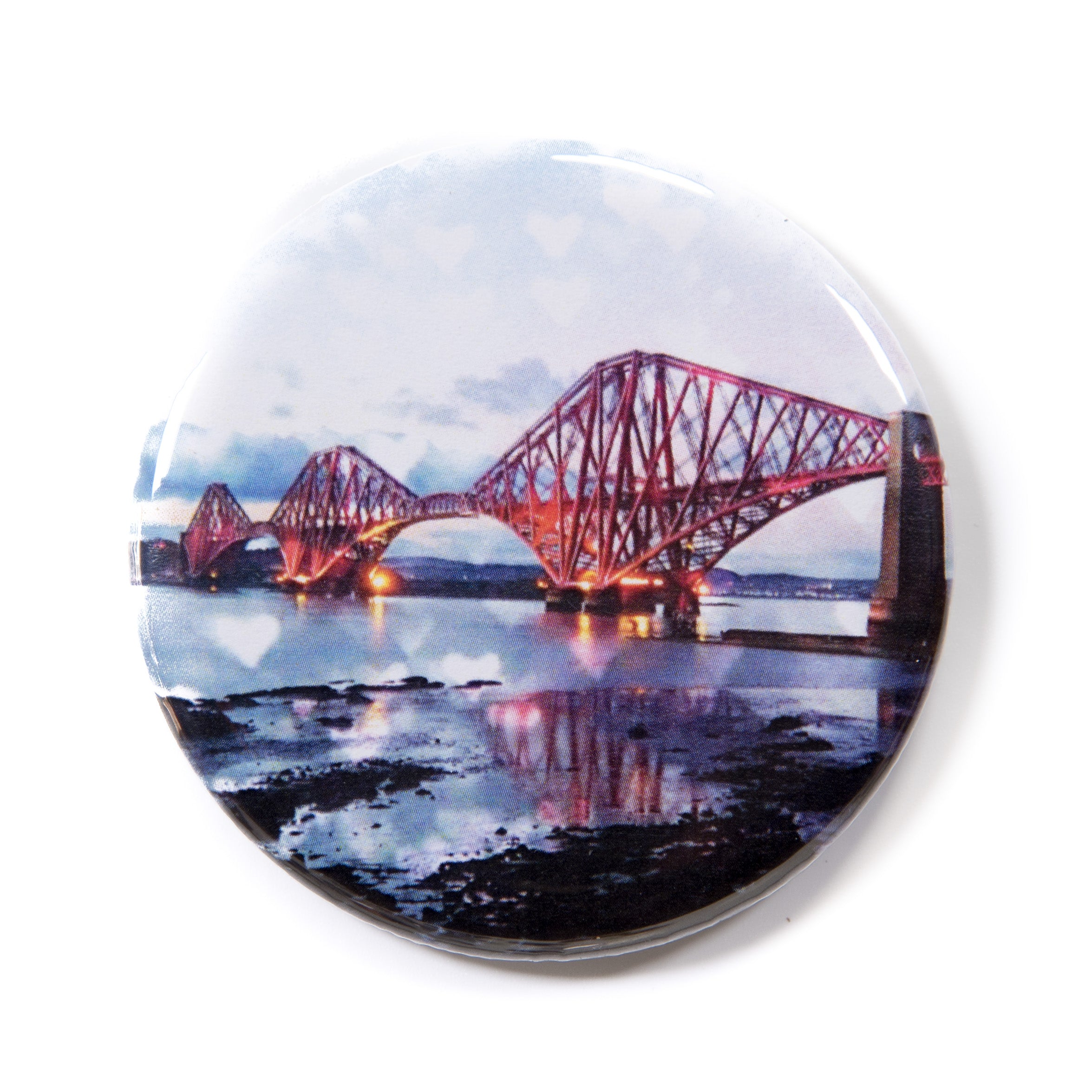 Round magnet with a scenic image of the Forth Bridge over water on a white background