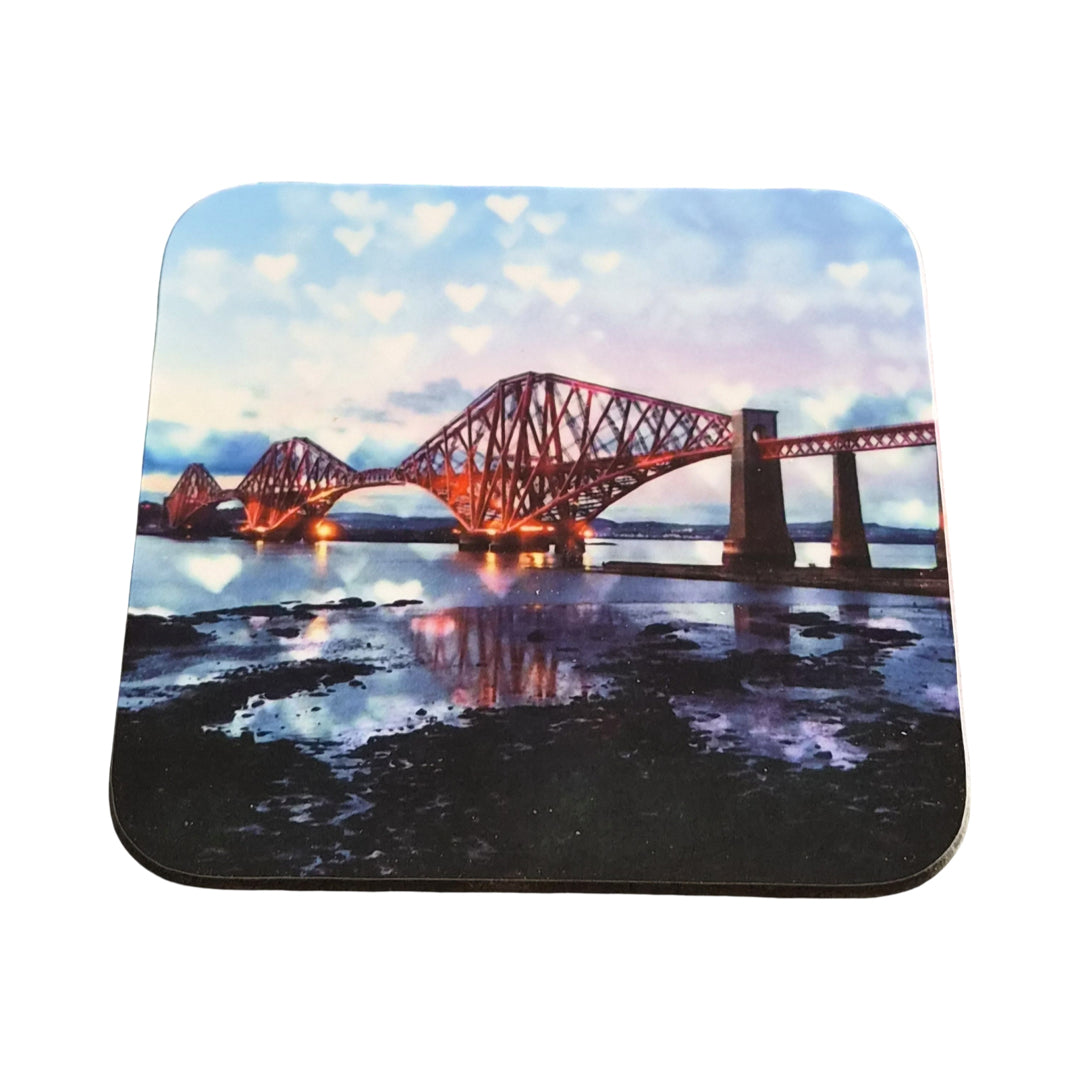 Coaster with a design of a bridge over water on a white background