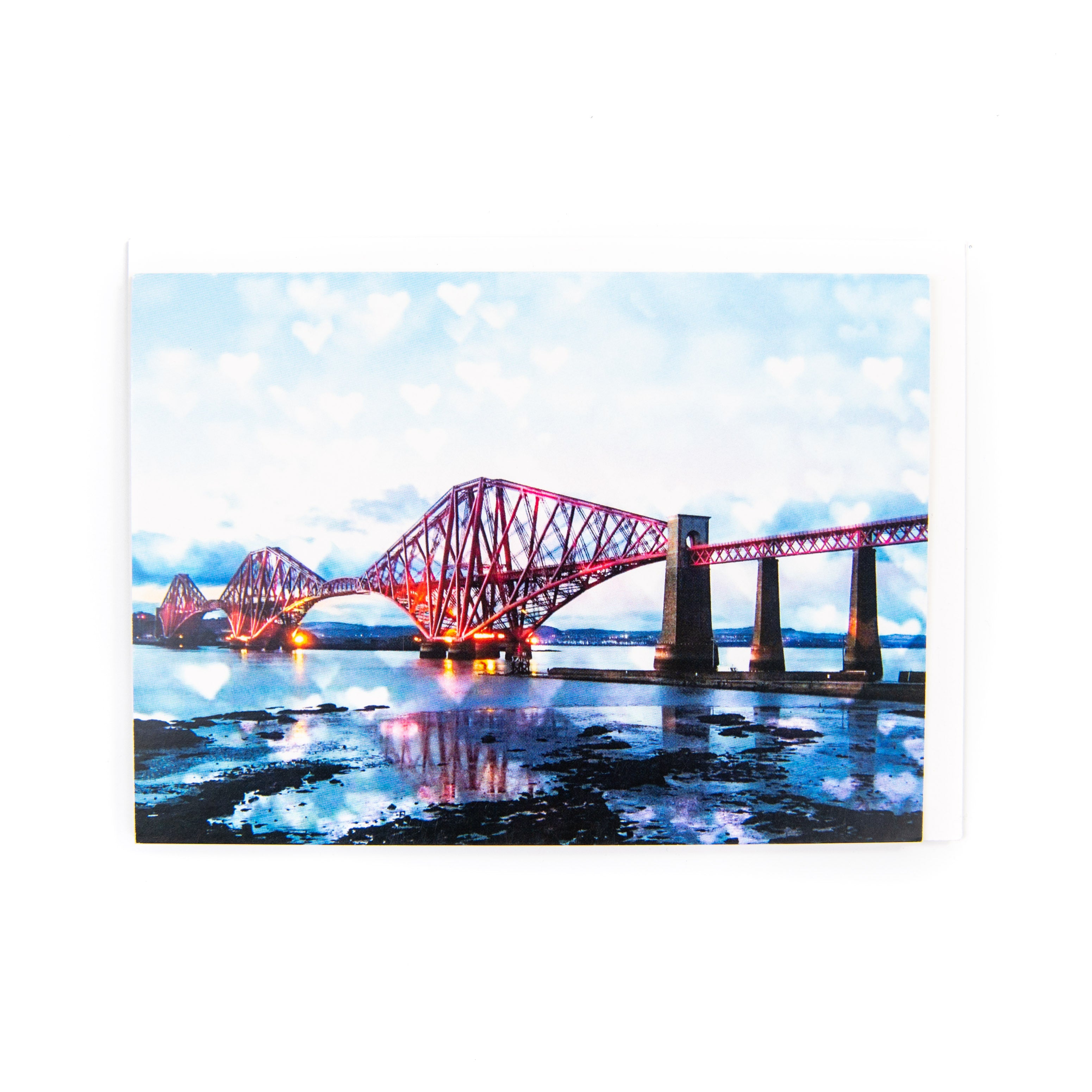 A greeting card featuring the Forth Bridge with a sky of love hearts, blank inside, with a white envelope.