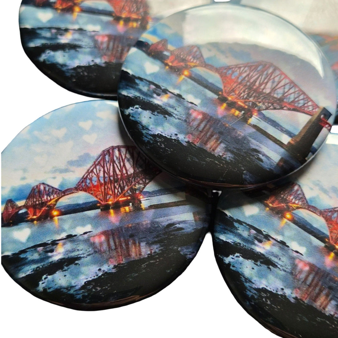 A group of round magnets with a picture of the Forth Bridge Edinburgh on them. 
