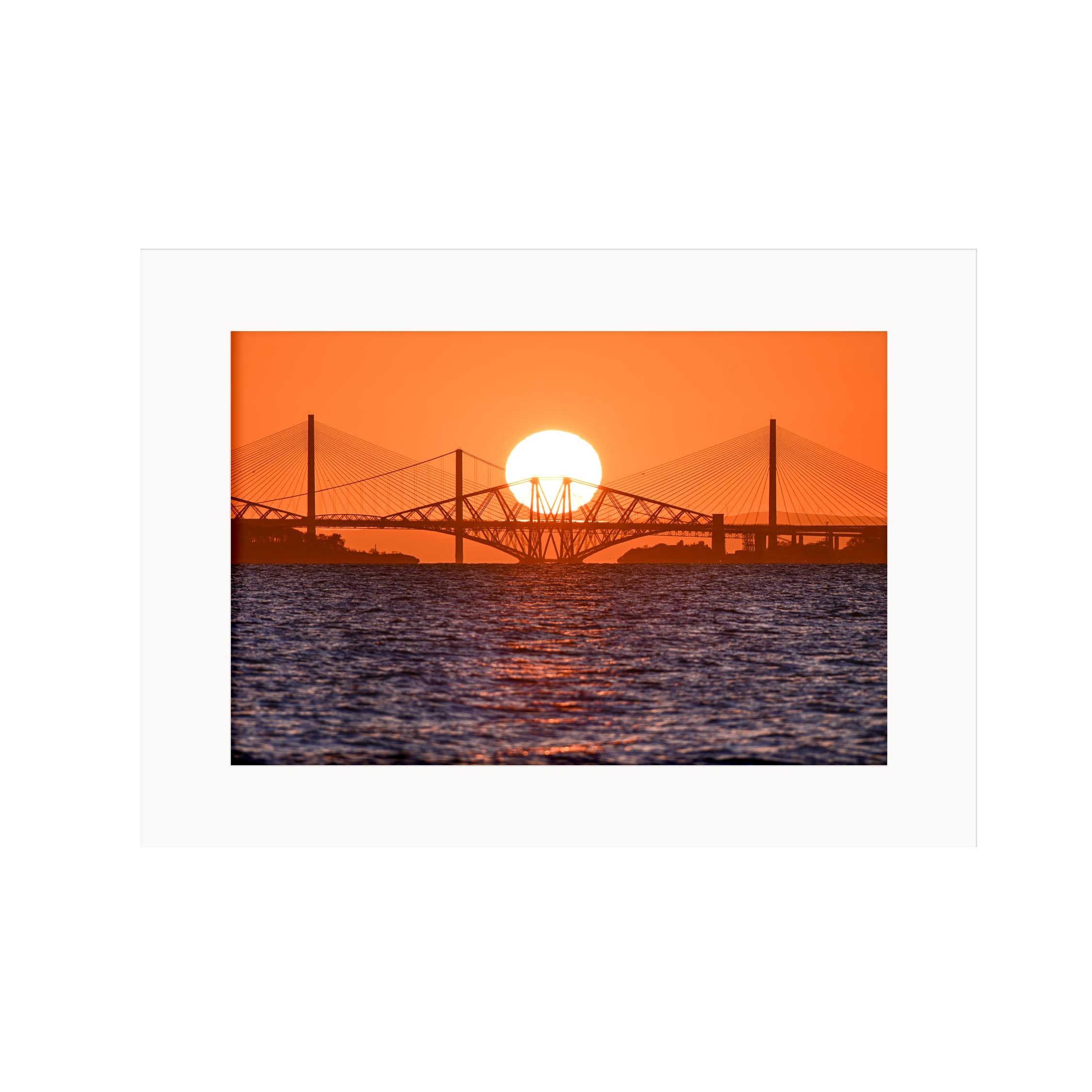 An image of the three bridges over the Forth with the sun setting behind them in a mount. 