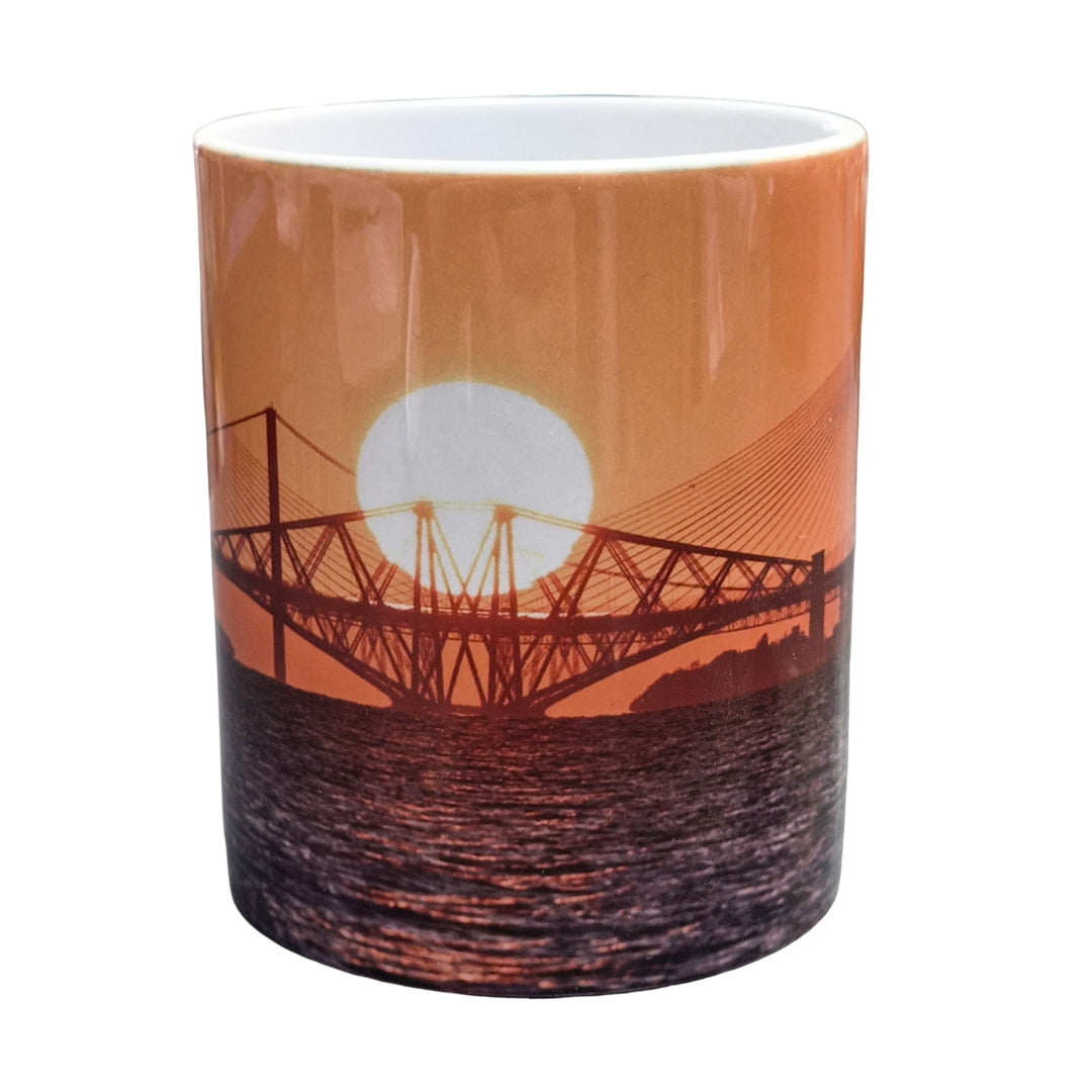 Mug with a sunset and bridge design on an orange background