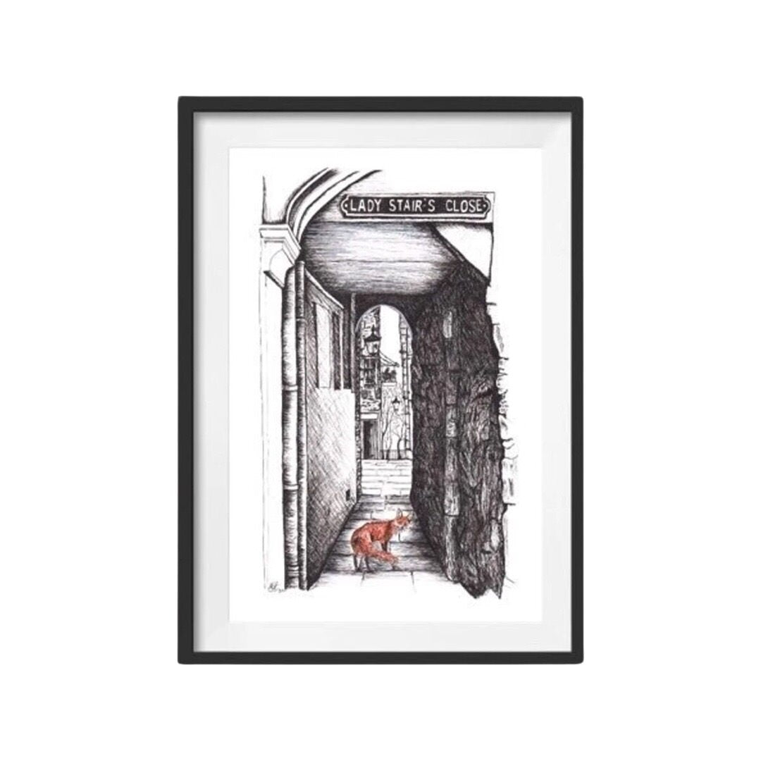 A framed illustrated print of a fox at Lady Stairs Close, Edinburgh