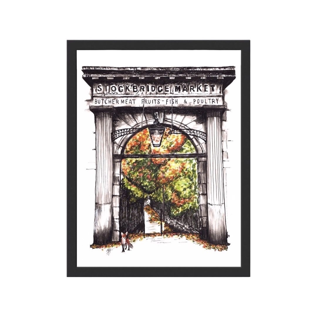 A framed illustrated print of a fox in front of the Old Stockbridge Market Arch at St Stephen Place, Stockbridge in Edinburgh.