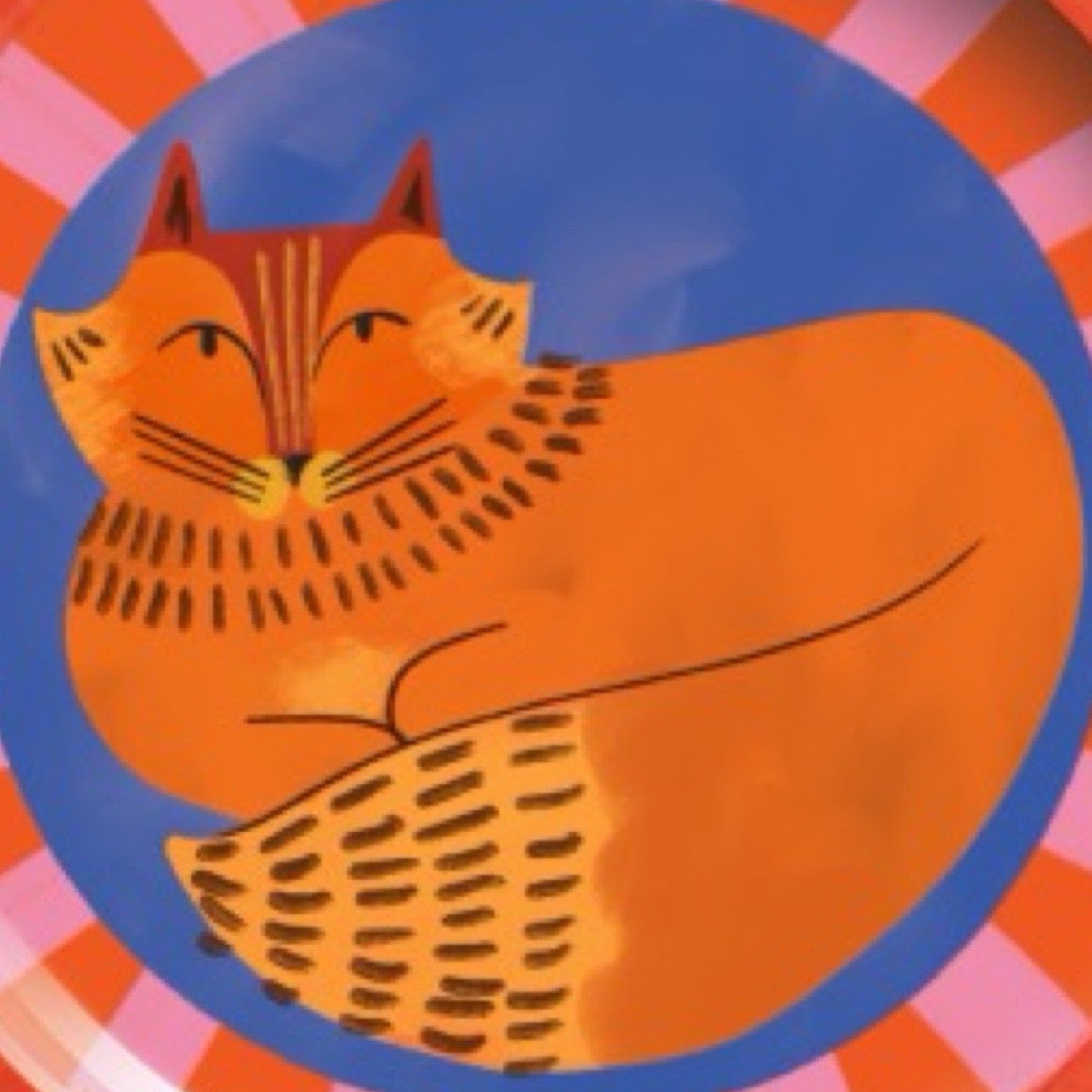 Colourful plate with a cat design on a white background.