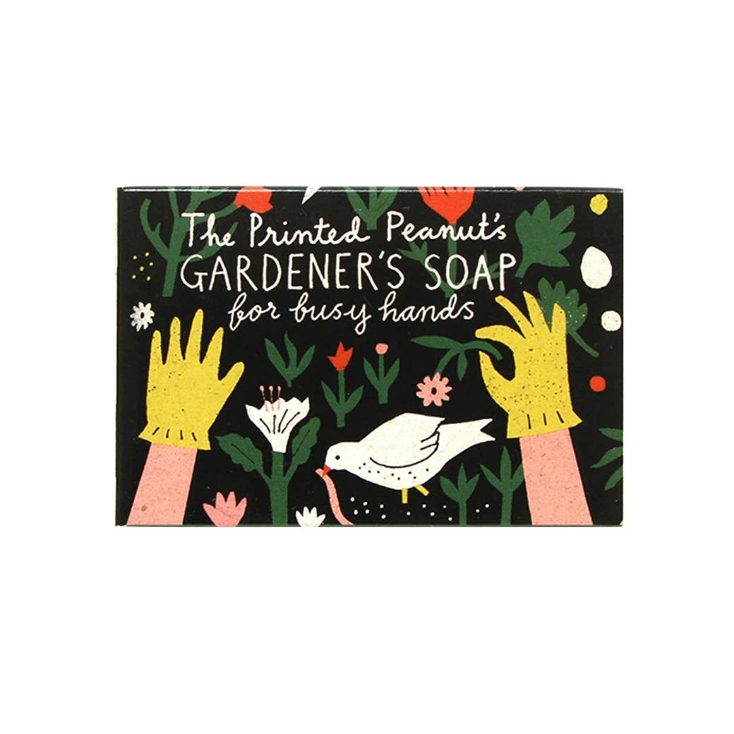 Soap packaging with gardening-themed design, including hands, plants, and a dove.