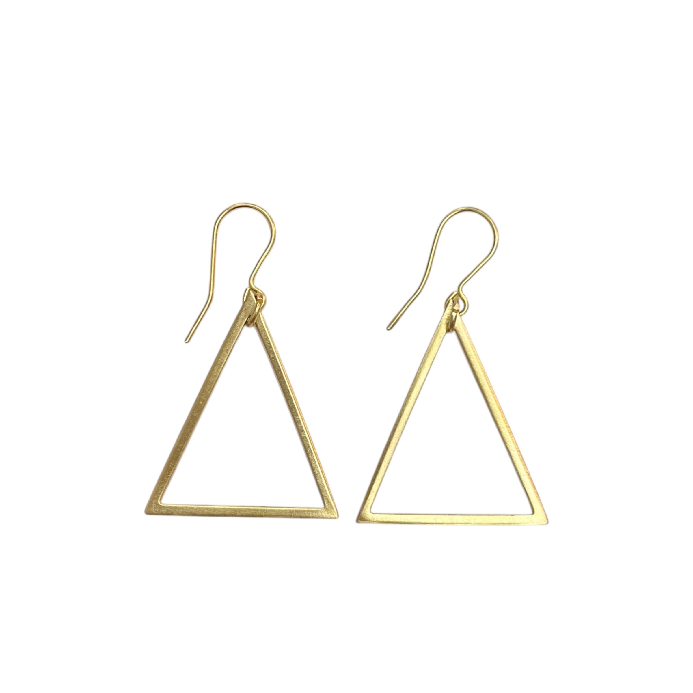 These Geo Triangle dangle earrings are made from brushed brass on gold-plated earring hooks.