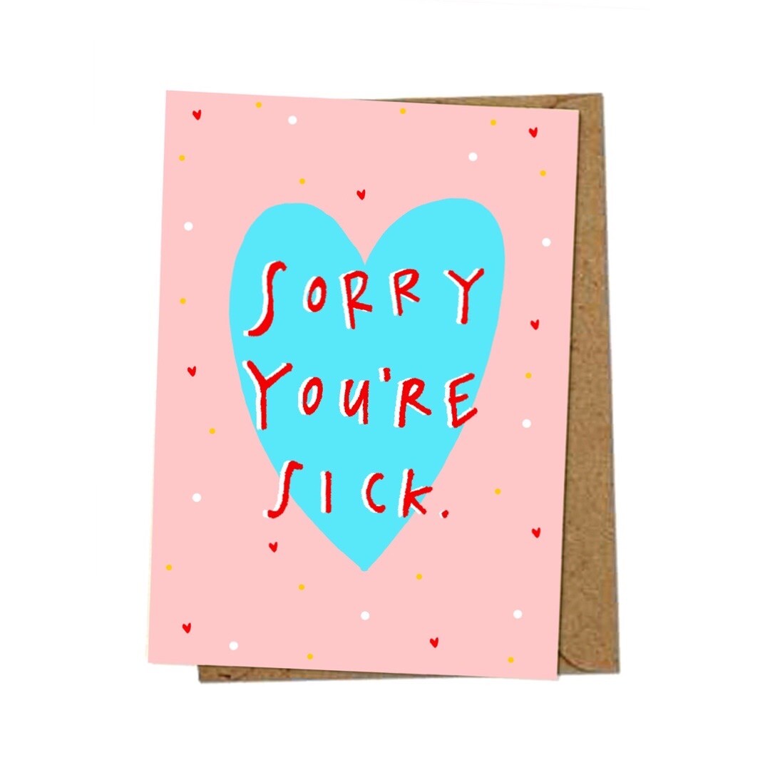 Get well soon card with the text 'Sorry You're sick' inside a large blue love heart on a pink background with little red love hearts.