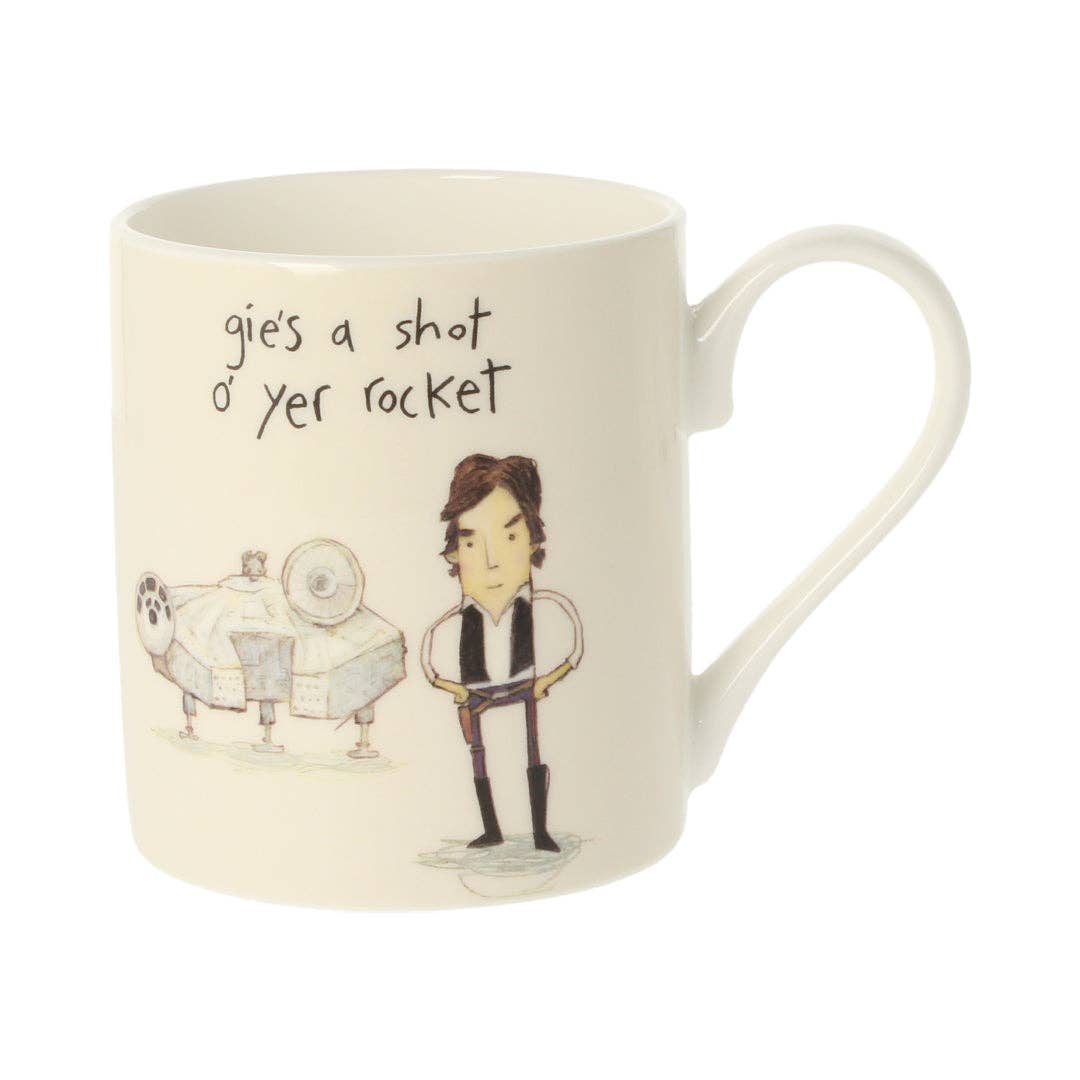 Mug with a cartoon character and a rocket ship and text on a white background.