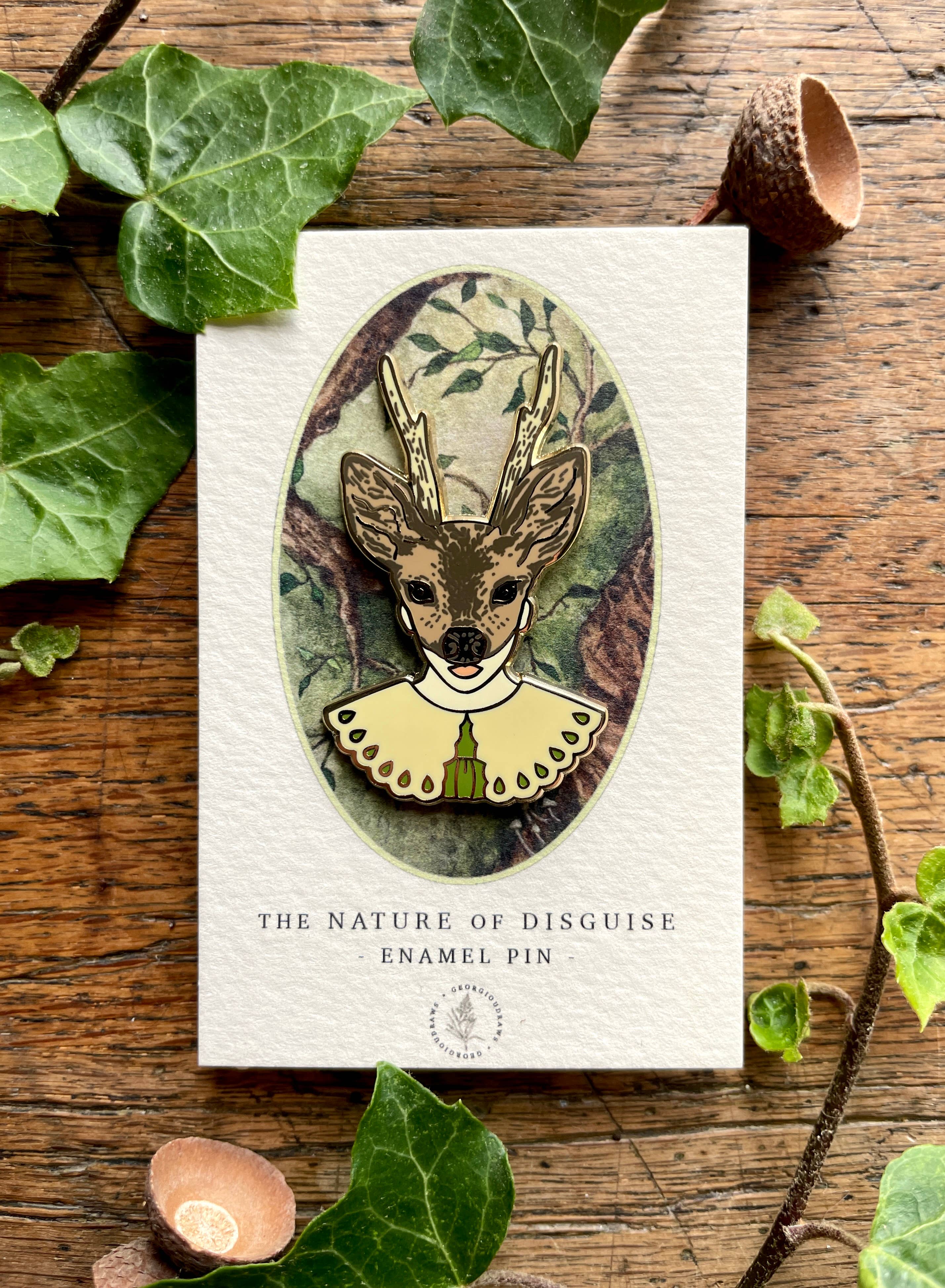 This enamel pin badge features a girl's head wearing a deer mask. 