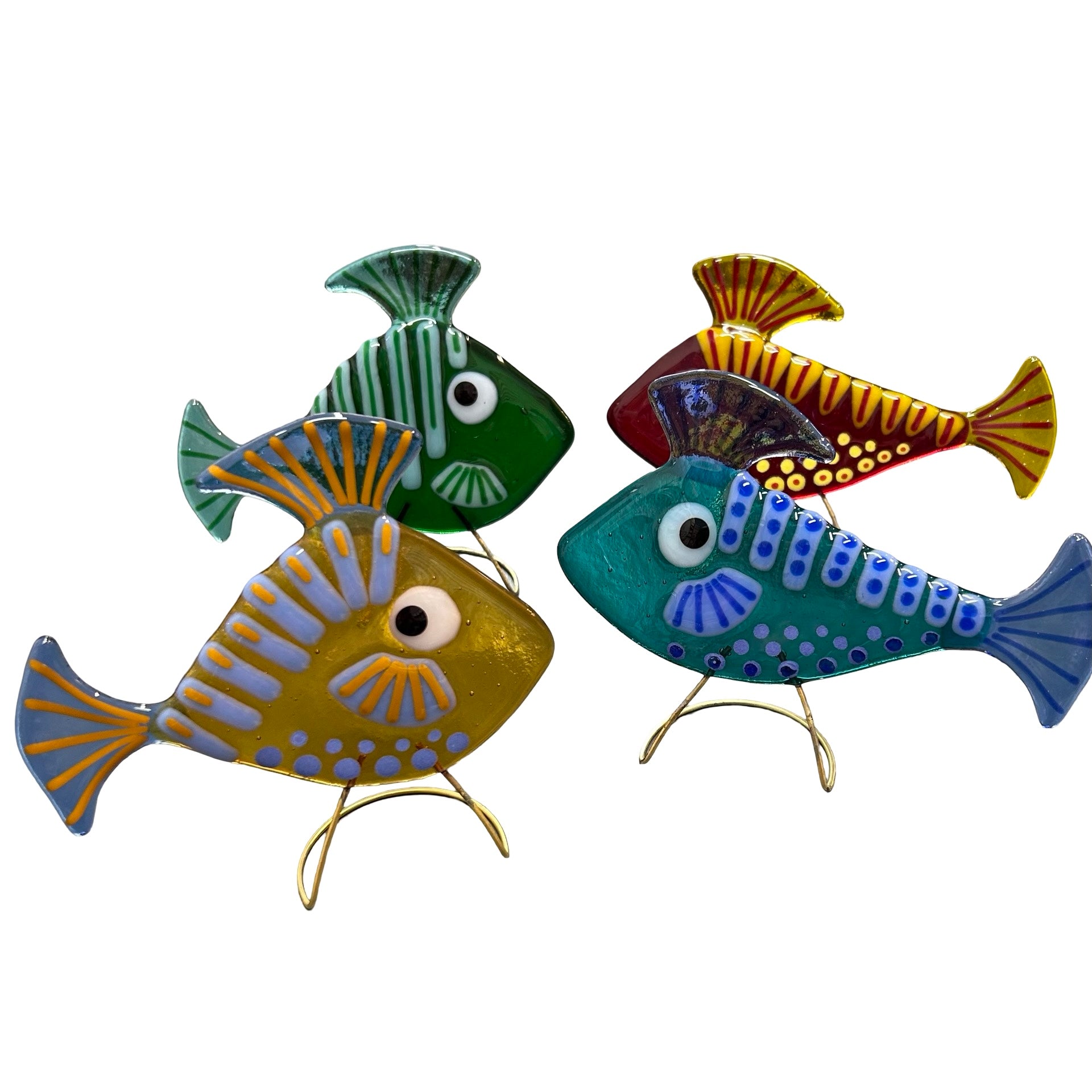Set of four colorful glass fish-shaped decorations on a white background.
