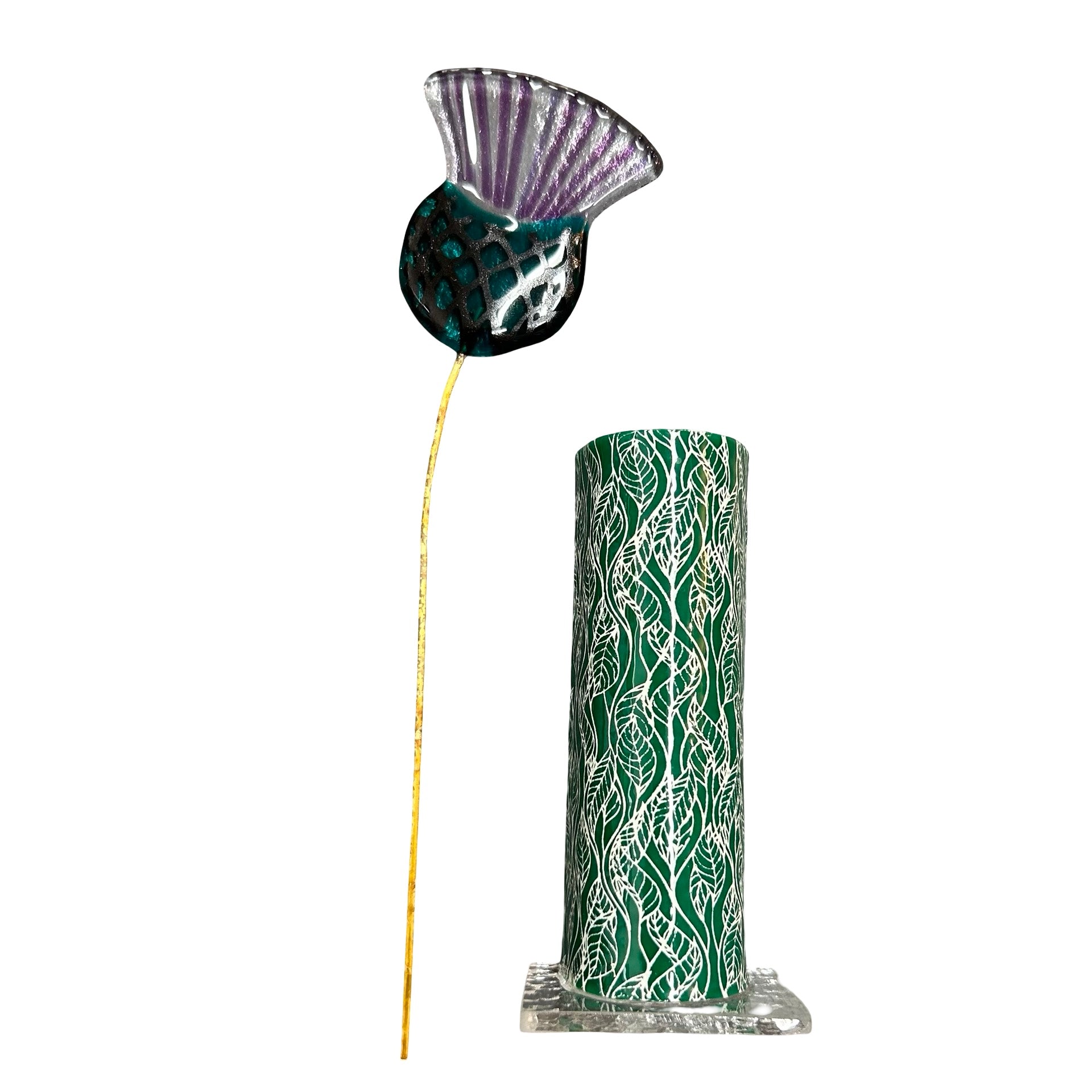 Decorative vase with leaves and a glass thistle on a white background.