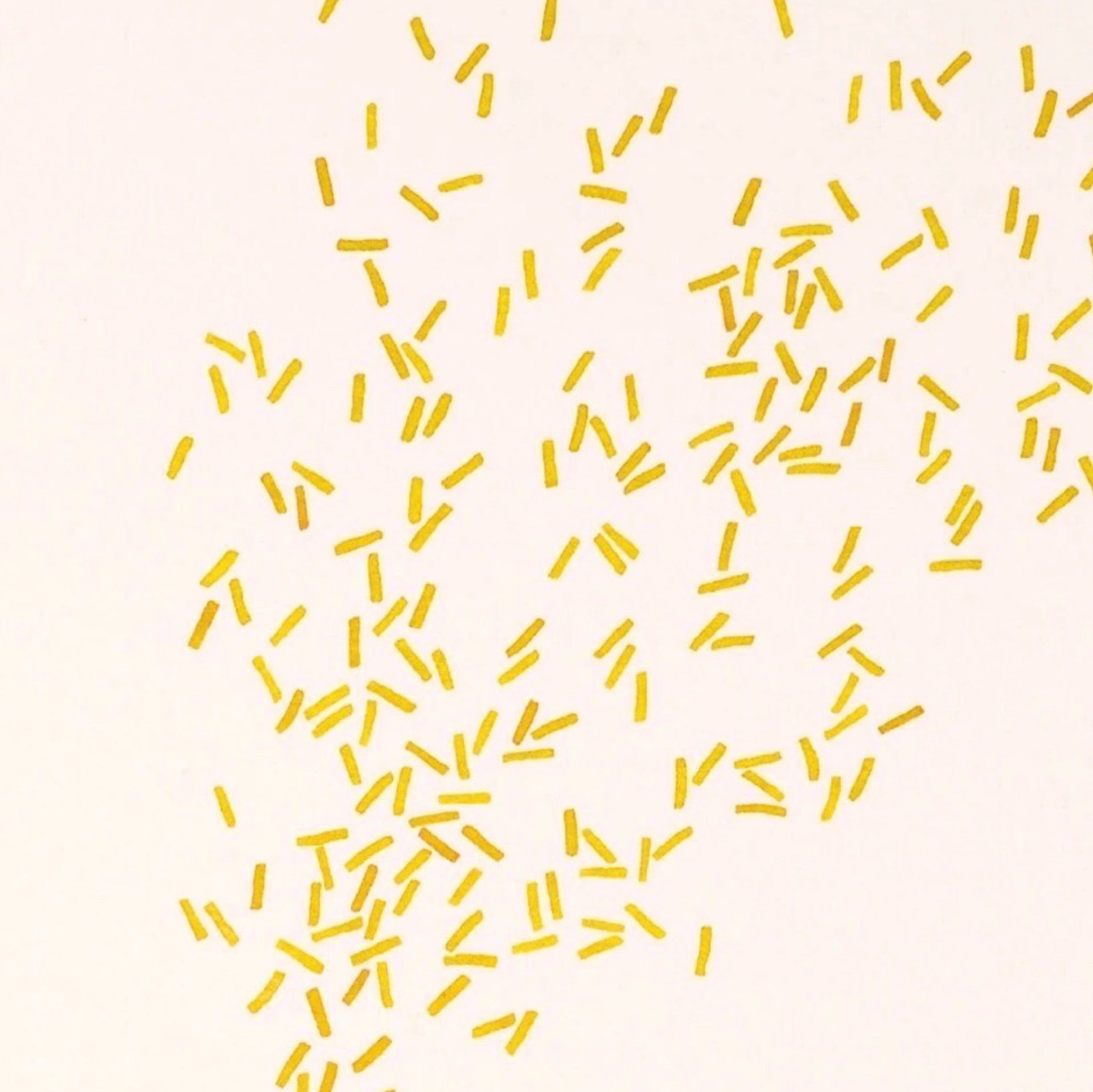Illustration of gold confetti on a beige background.