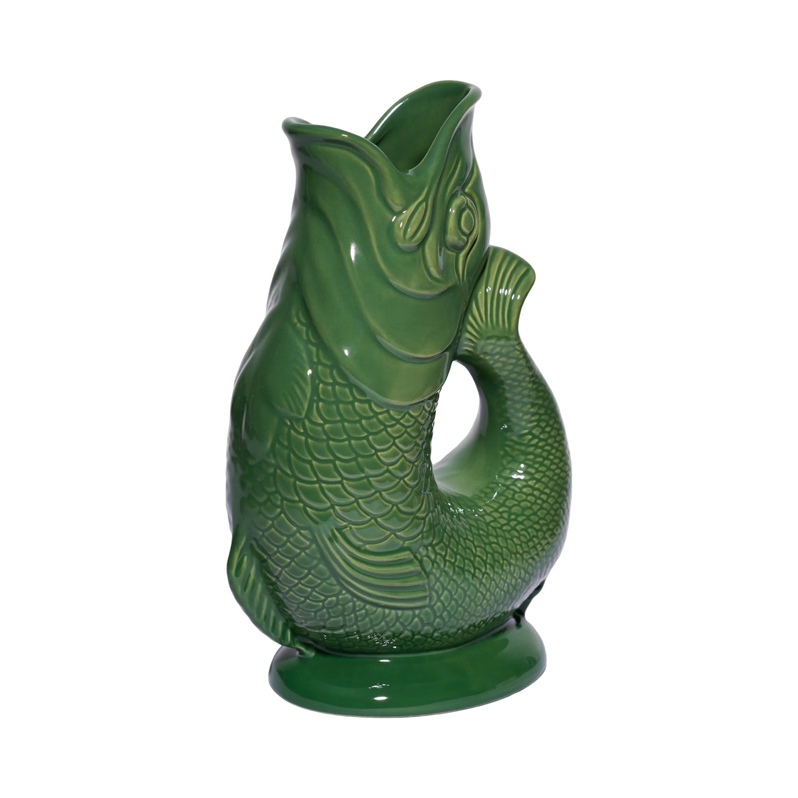 A green fish shaped gluggle jug.