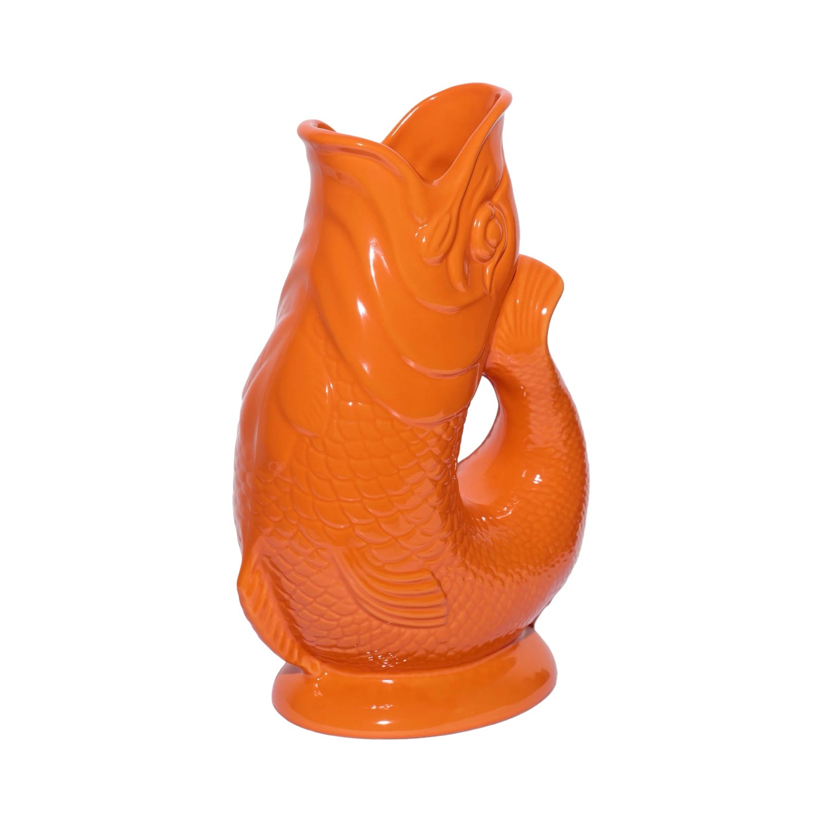 An orange fish shaped gluggle jug.