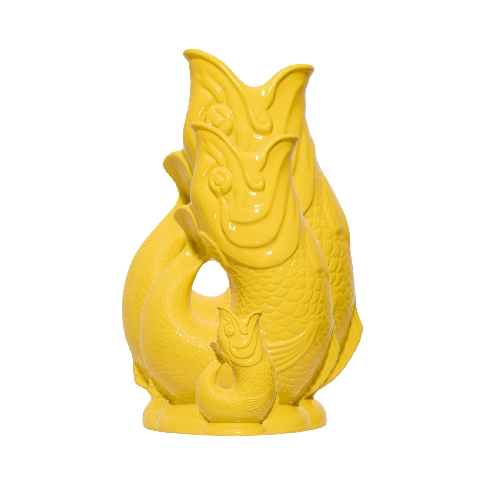A yellow fish shaped gluggle jug.