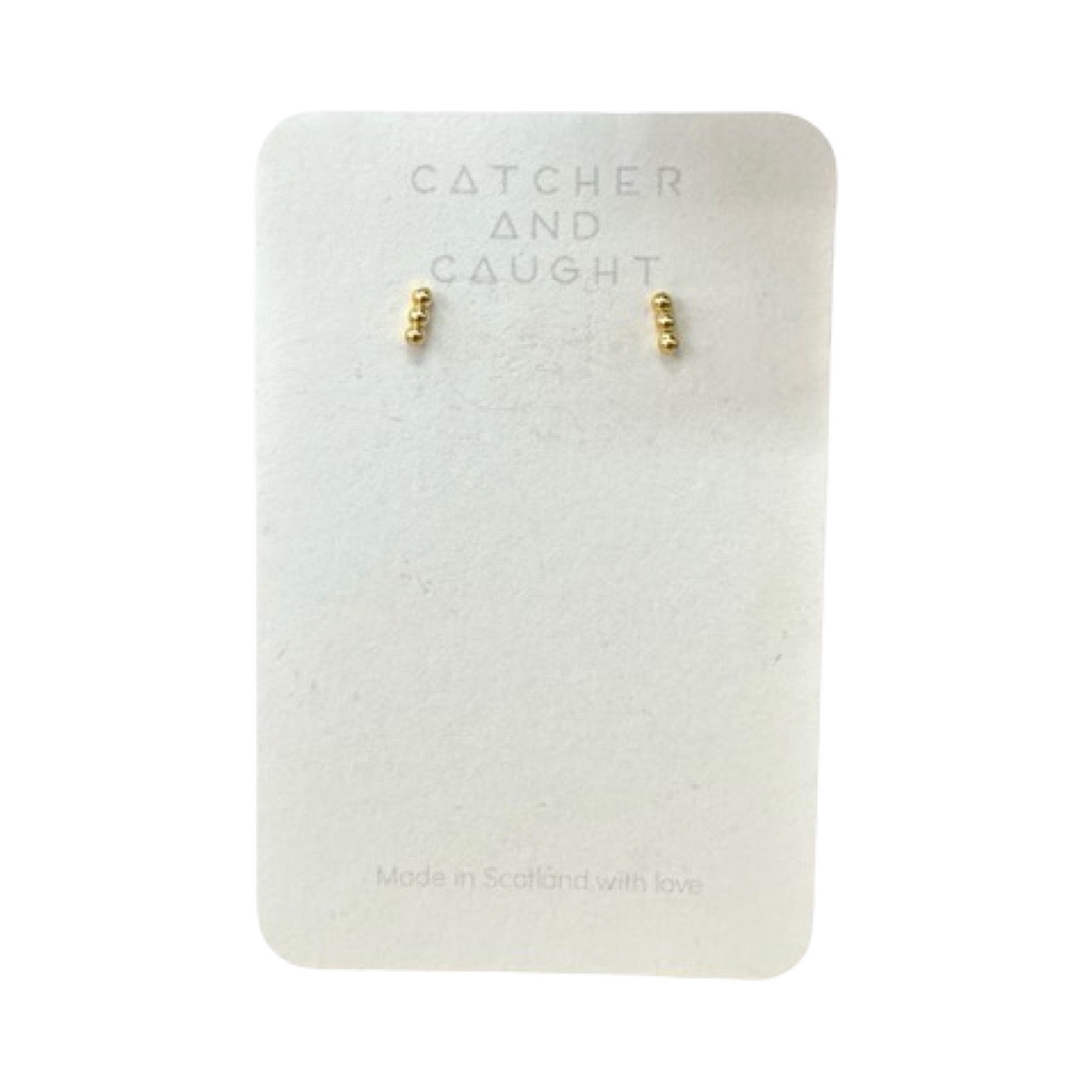 Gold bubble earrings packaged.