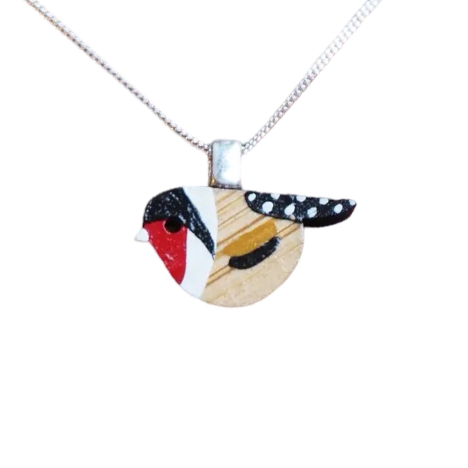 A bird-shaped red and black goldfinch painted pendant with a sterling silver chain.