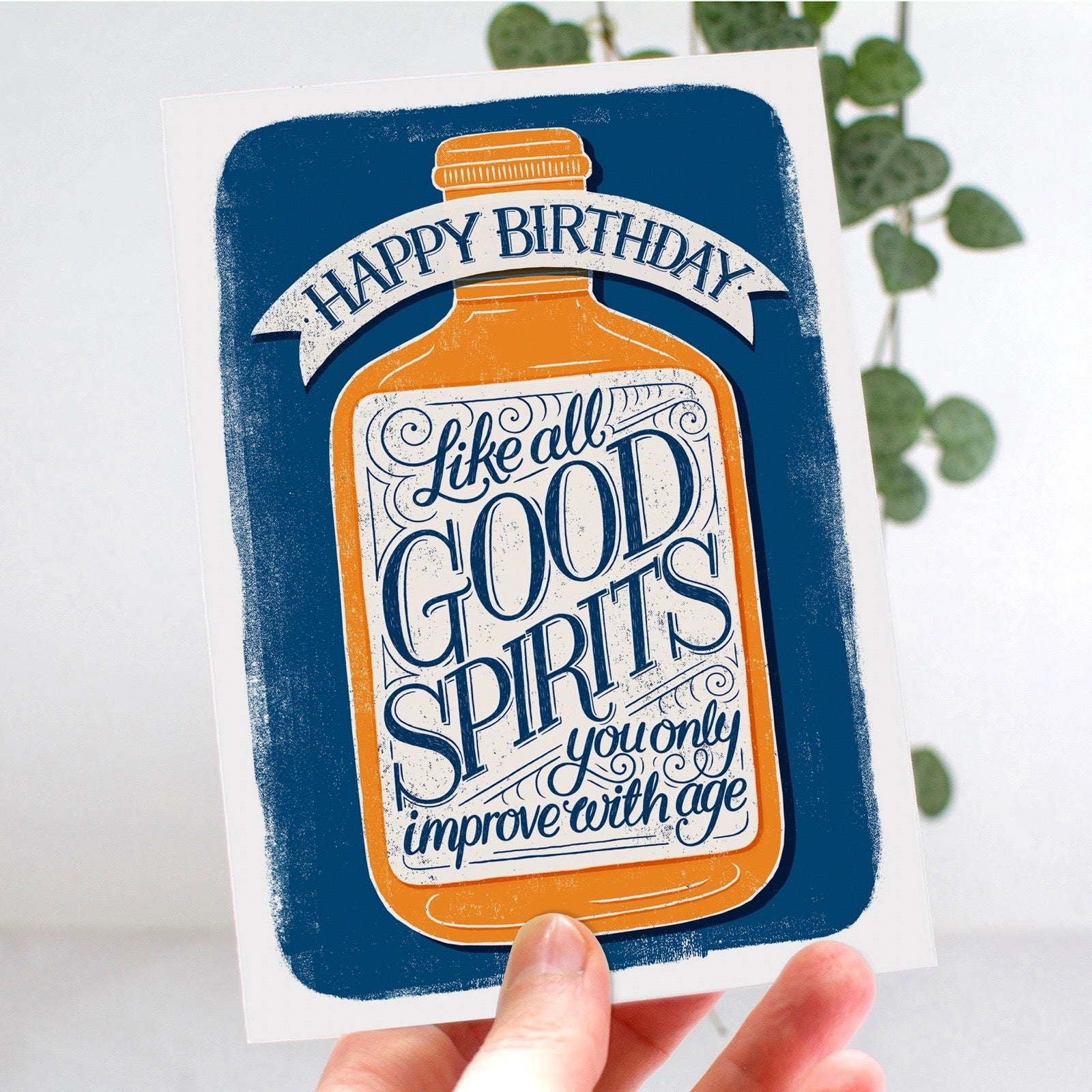 Birthday card with bottle design and text on a white background.