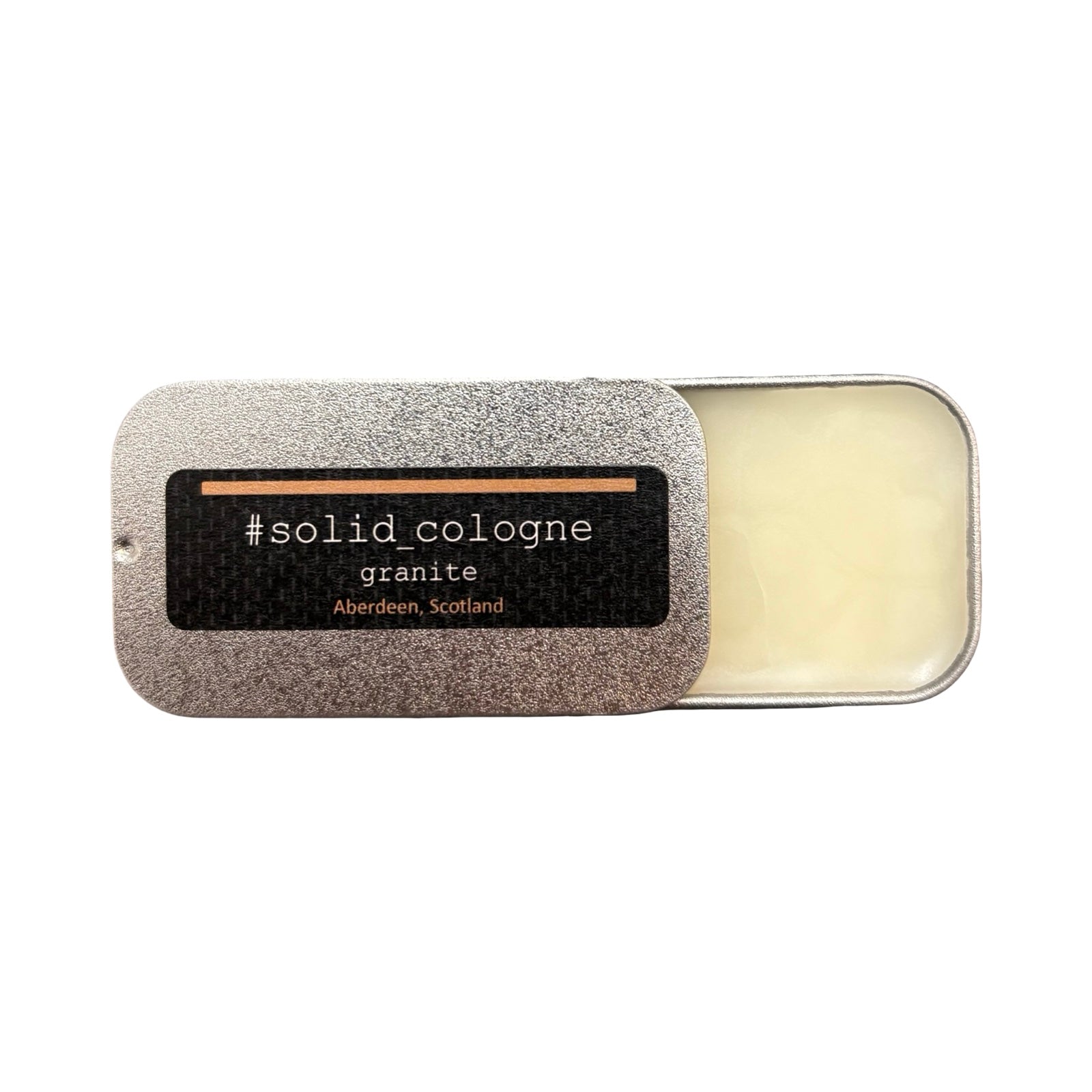 Granite Solid Cologne, A rich floral woody musk fragrance combining notes of rose, saffron, thyme and tea with base notes of amber, suede musk and sandalwood, all in this little tin!